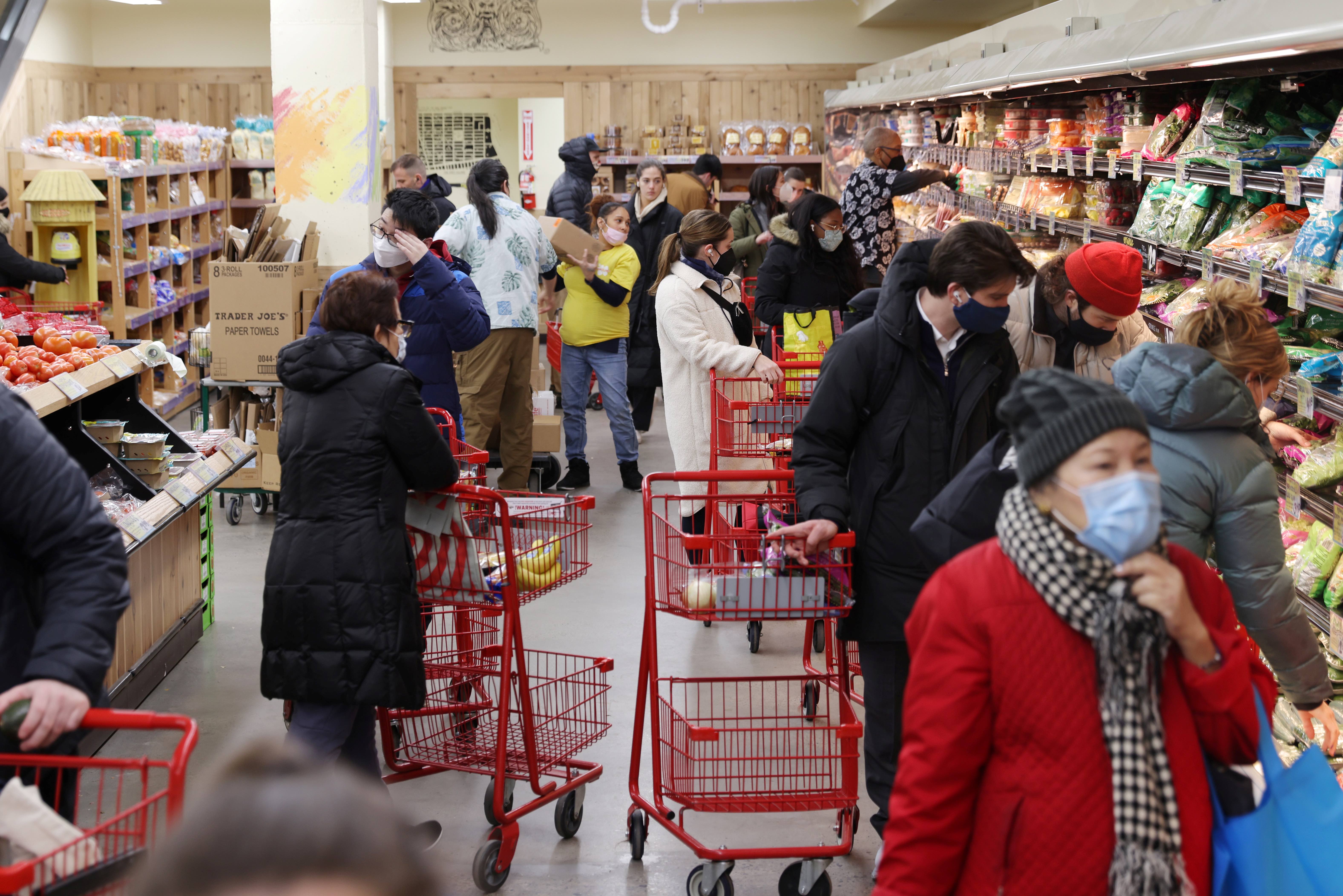 People shop in a grocery store in Manhattan, New York City, U.S.
