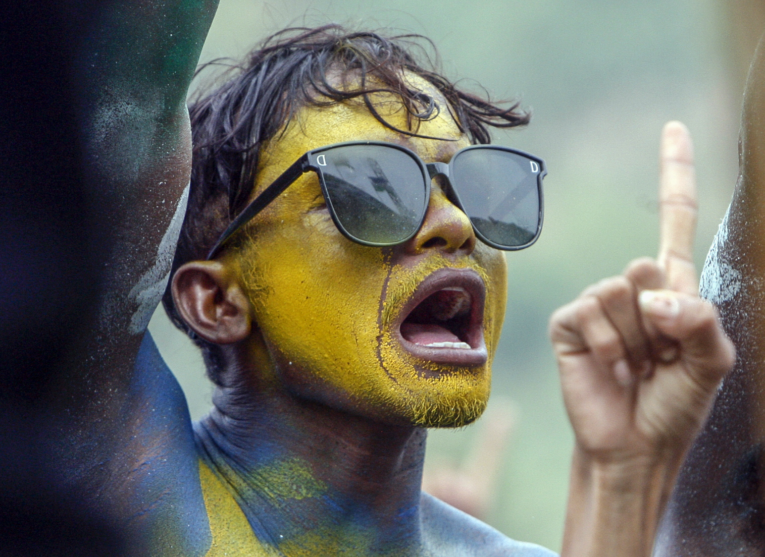 A young Timorese with their face painted yellow to support Jose Ramos Horta
