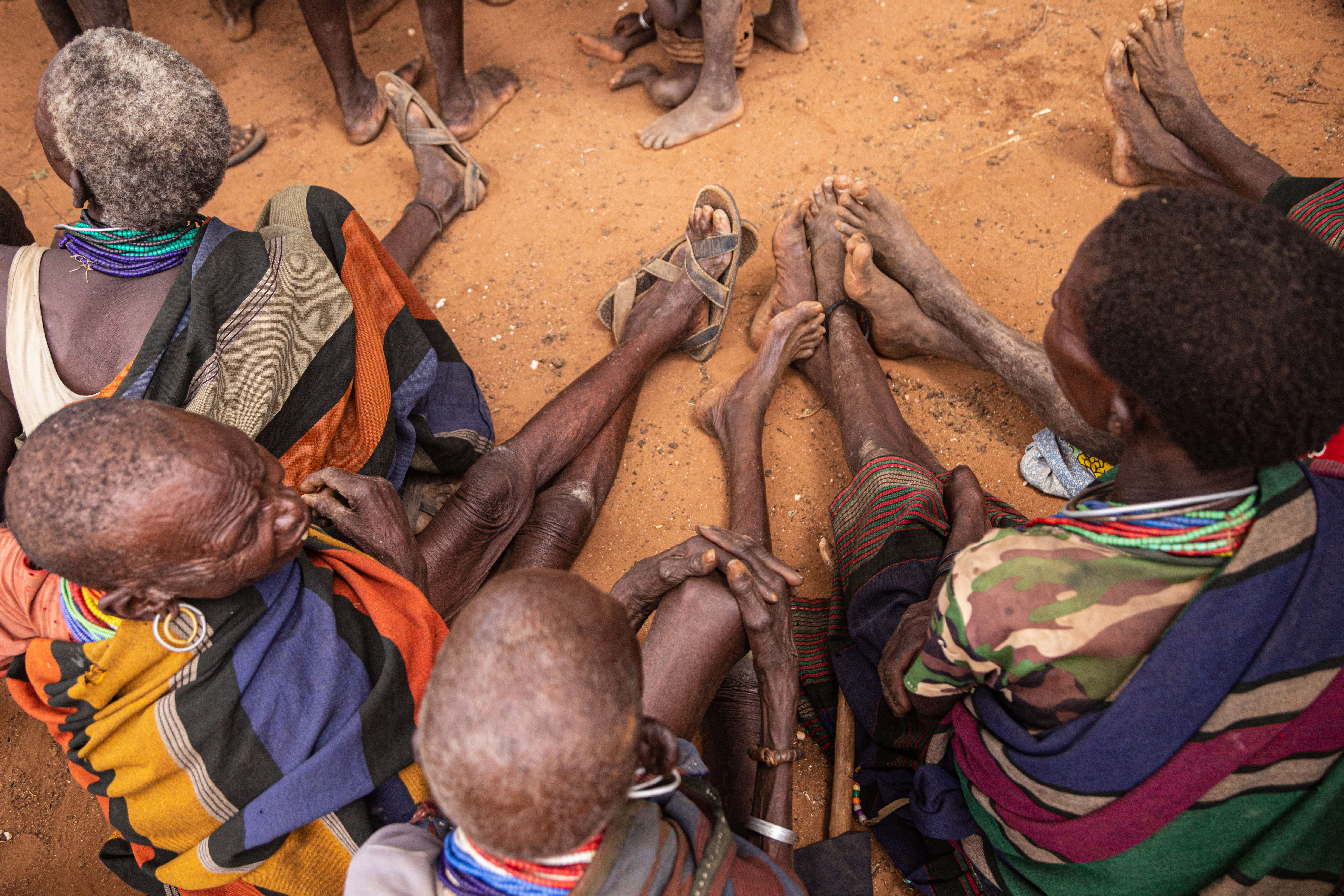 Elderly women attend a village meeting on malnutrition in Rupa