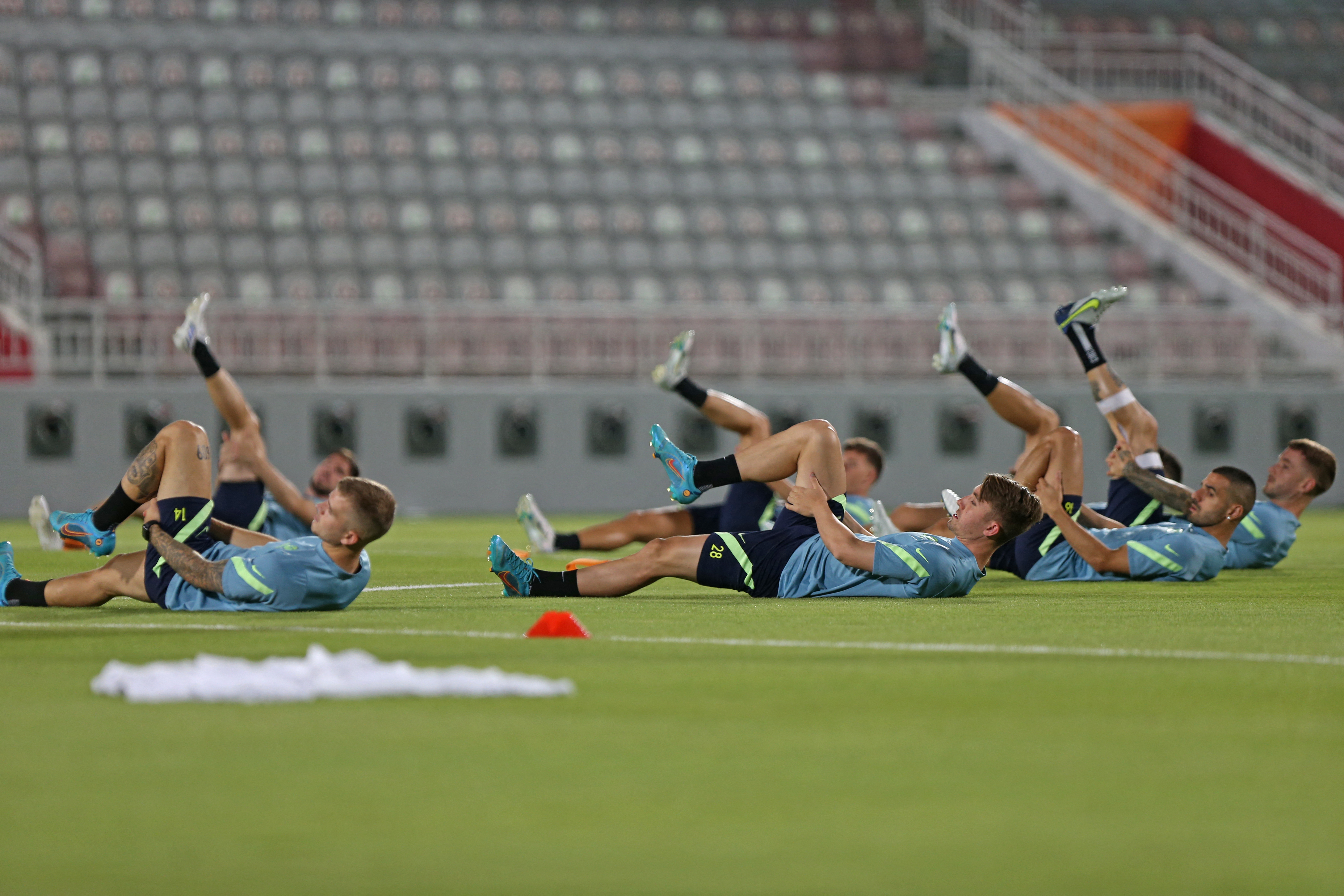 Australia's players take part in a training session at the Abdullah bin Khalifa Stadium in the Qatari capital Doha on June 12, 2022