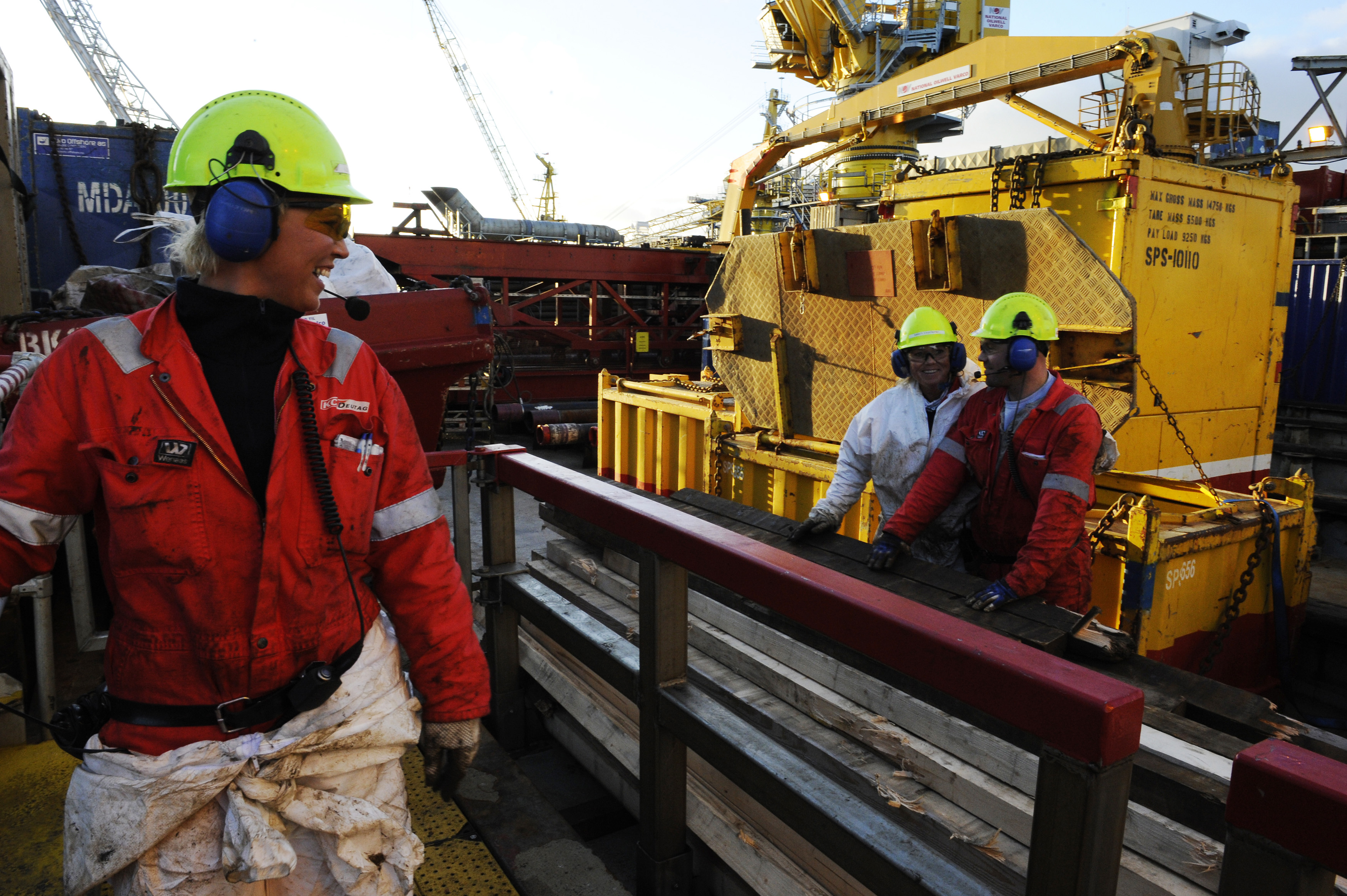 Oil workers are pictured as they work at the Oseberg oil field, in the North Sea