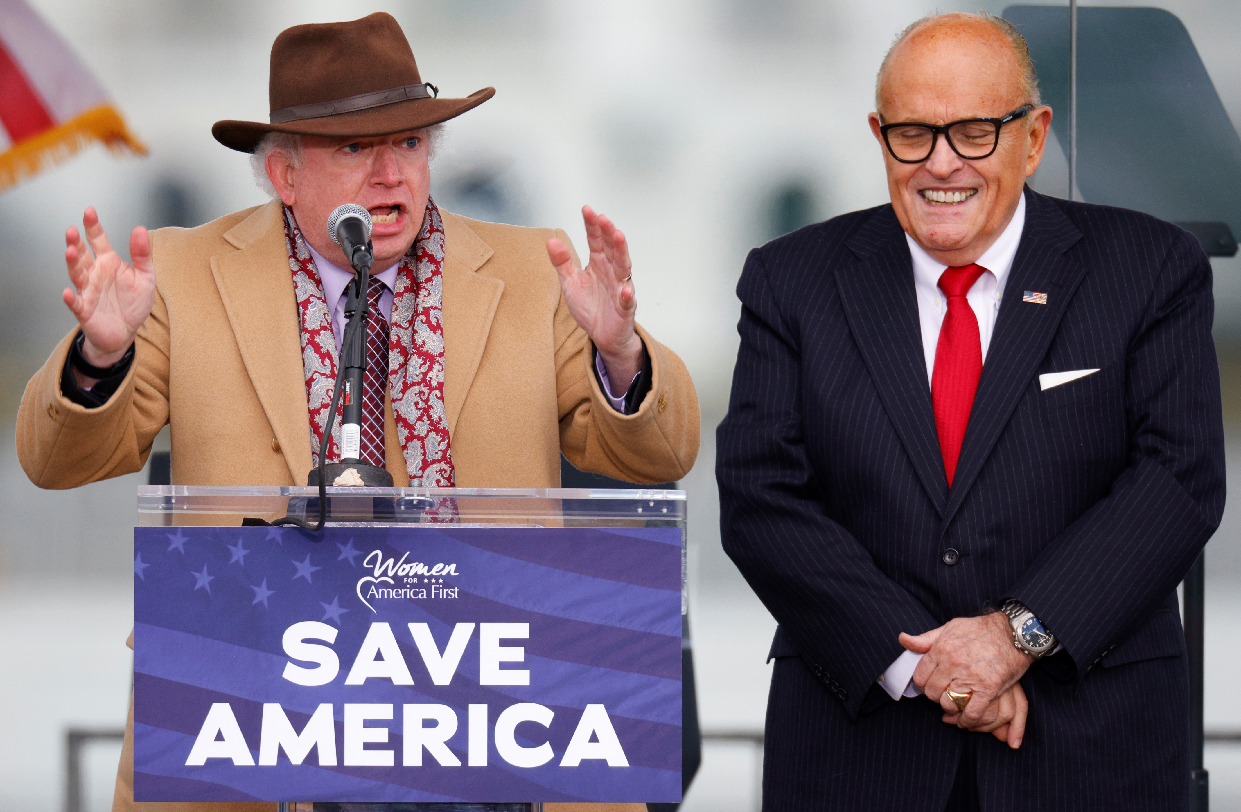 Lawyer John Eastman (left) gestures at a rally next to former Trump lawyer Rudy Giuliani