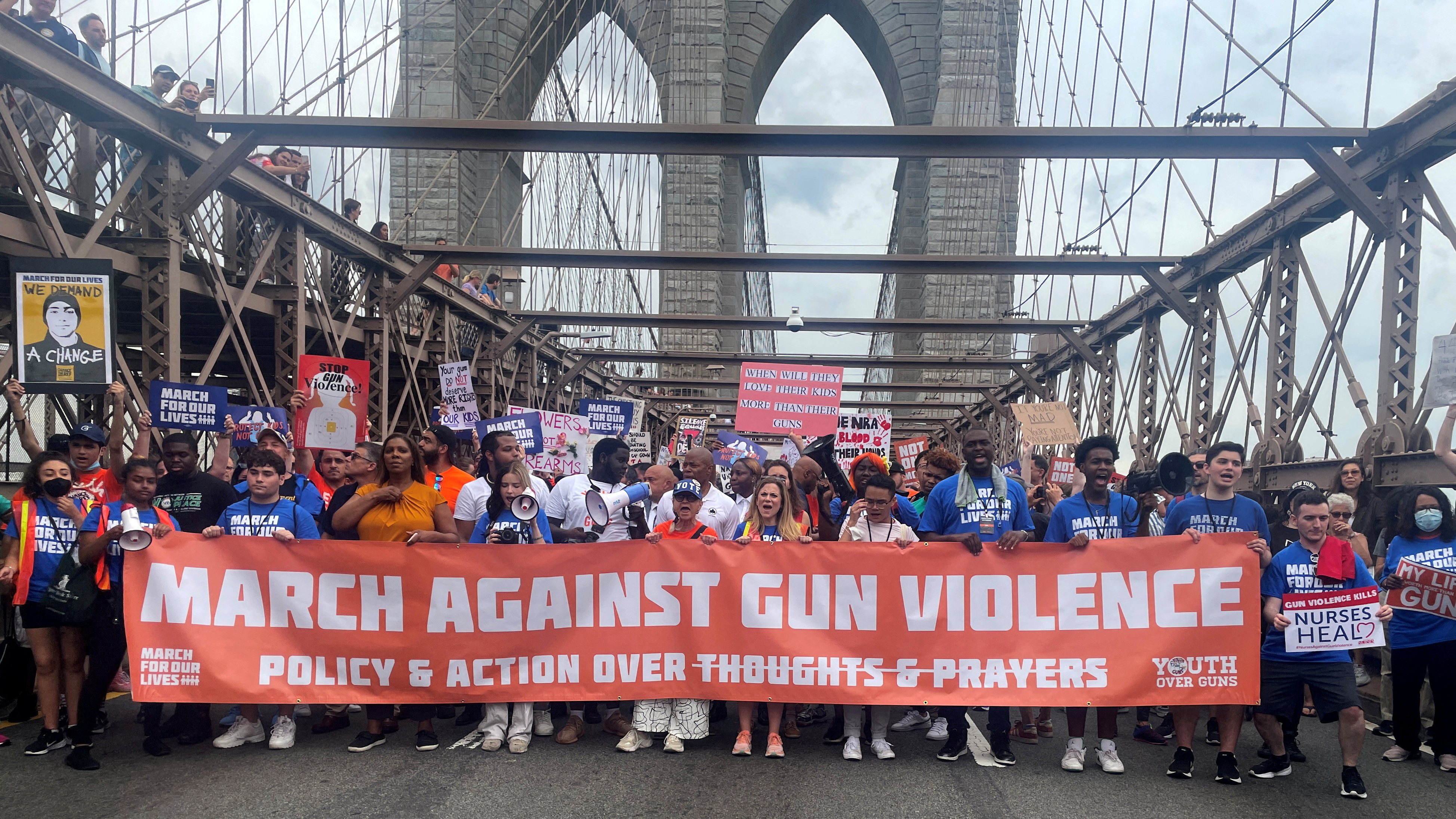 People cross the Brooklyn Bridge as they attend "March for Our Lives" rally, one of a series of nationwide protests against gun violence, New York City