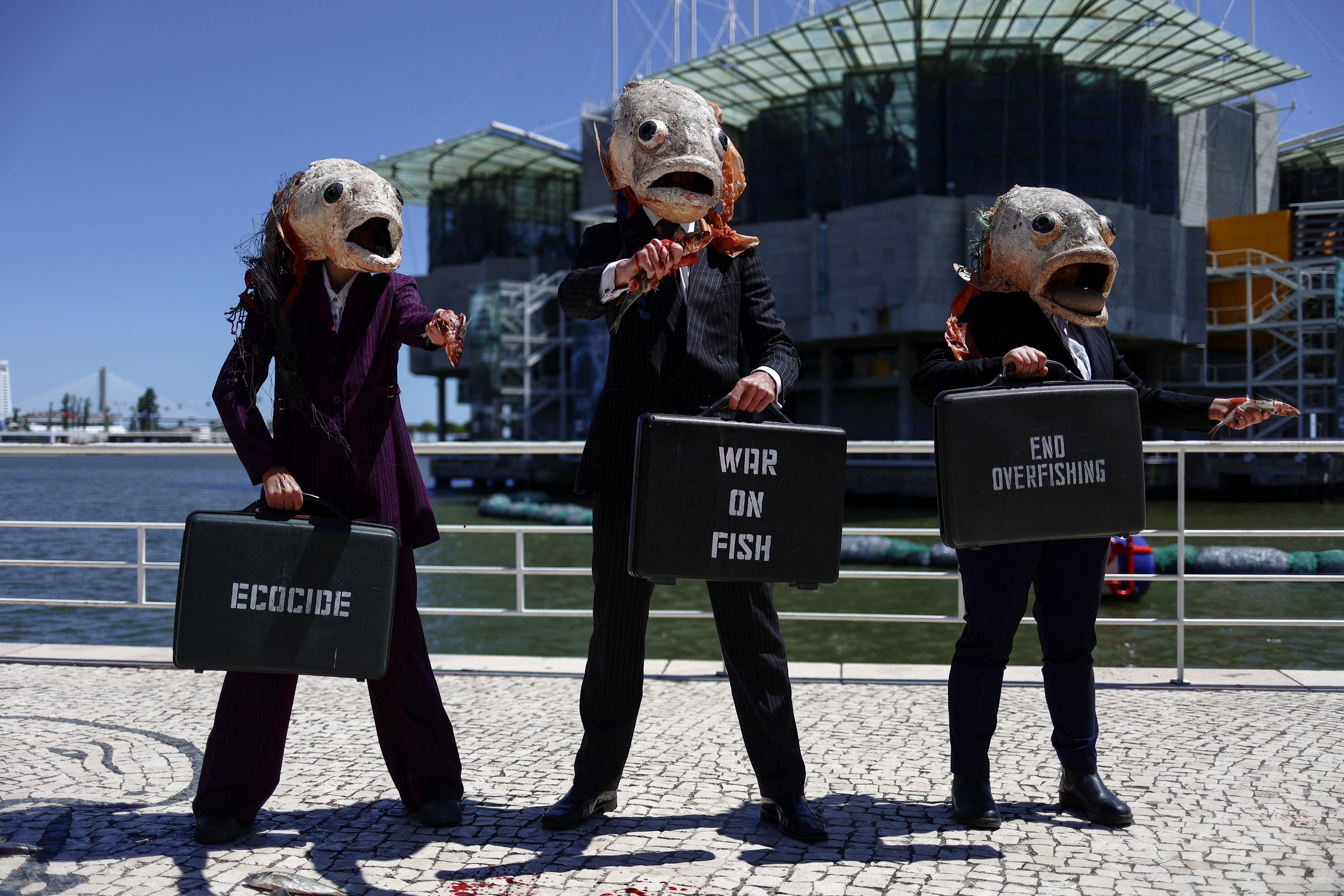 Ocean Rebellion activists gather outside the UN Ocean Conference to protest against what they describe as a "war on fish", in Lisbon