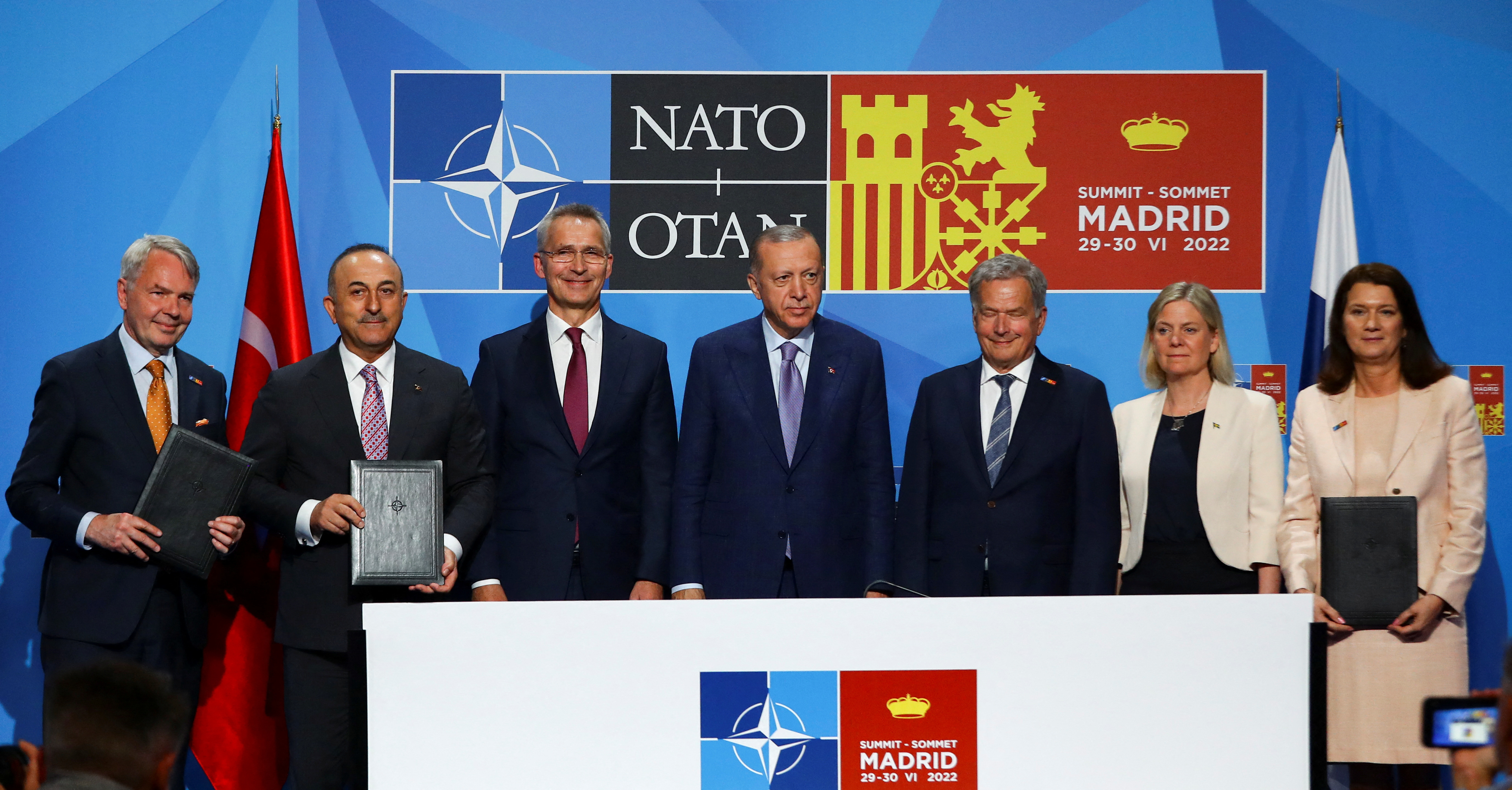 Turkish President Tayyip Erdogan, Finland's President Sauli Niinisto, Sweden's Prime Minister Magdalena Andersson and NATO Secretary General Jens Stoltenberg deliver a statement during a NATO summit in Madrid, Spain [File:Violeta Santos Moura/Reuters]