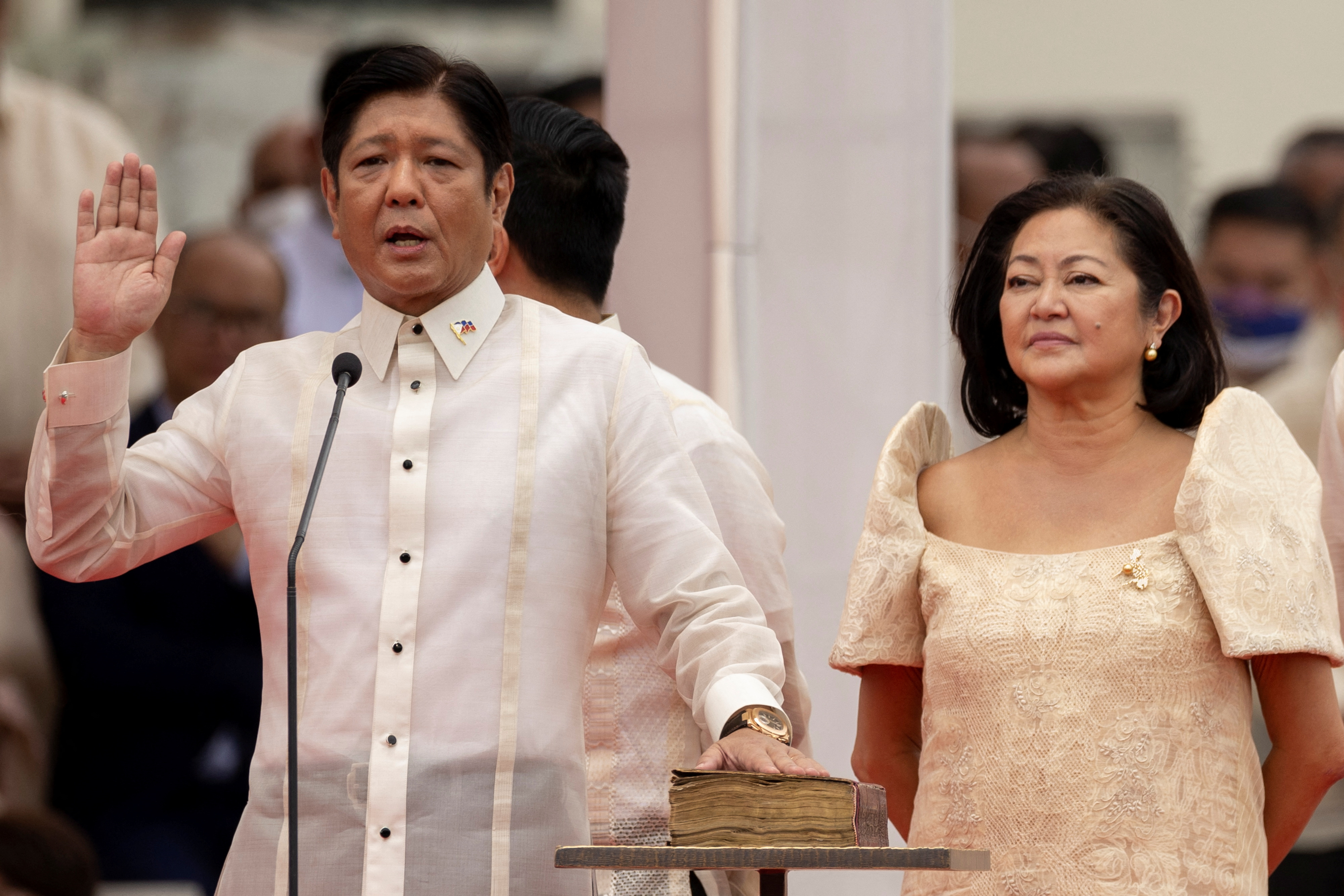 Ferdinand "Bongbong" Marcos Jr., the son and namesake of the late dictator Ferdinand Marcos, takes oath beside his wife Louise Araneta-Marcos during the inauguration ceremony at the National Museum in Manila, Philippines, June 30, 2022.