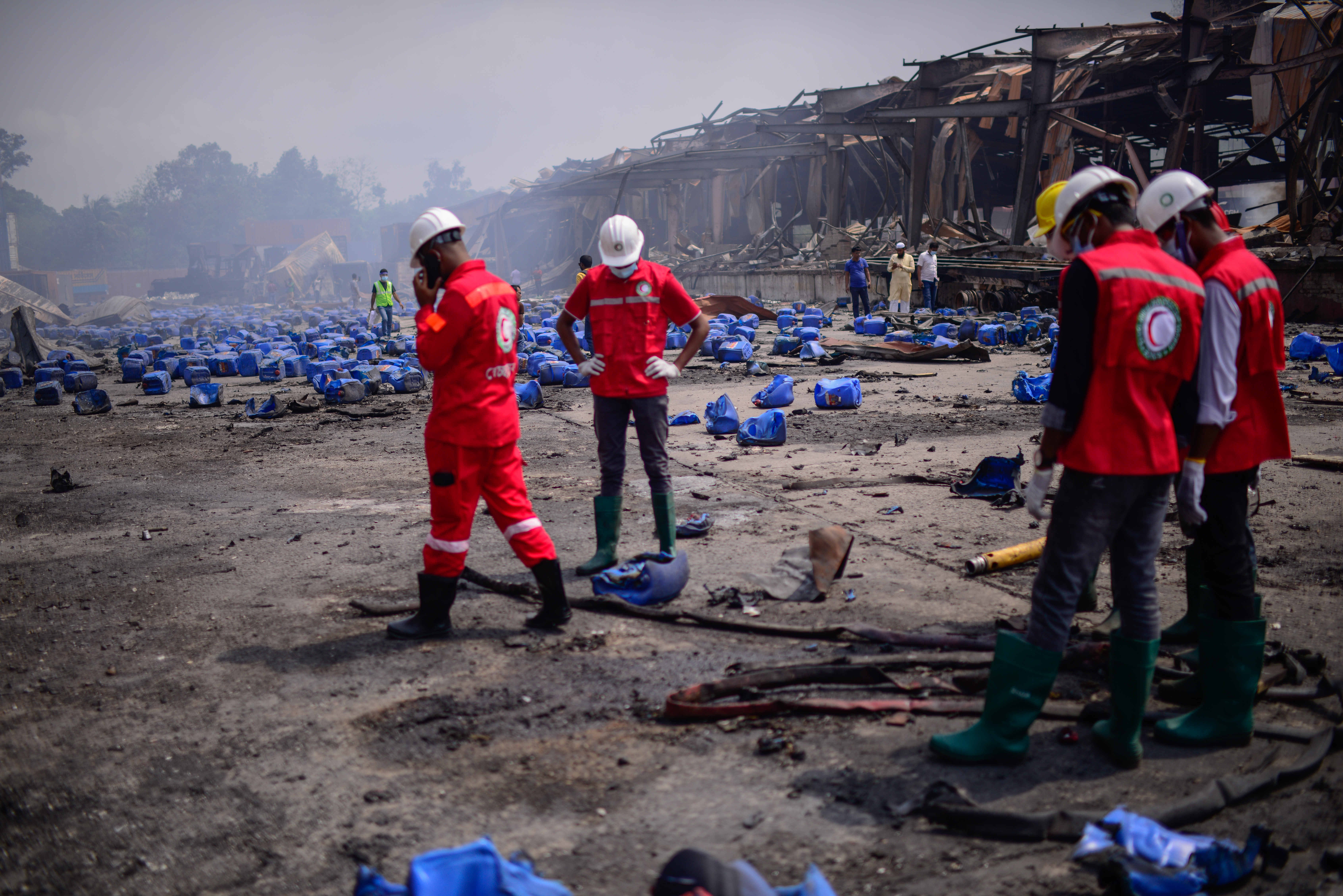 Bangladesh Red Crescent Society members stand at the BM Inland Container Depot.