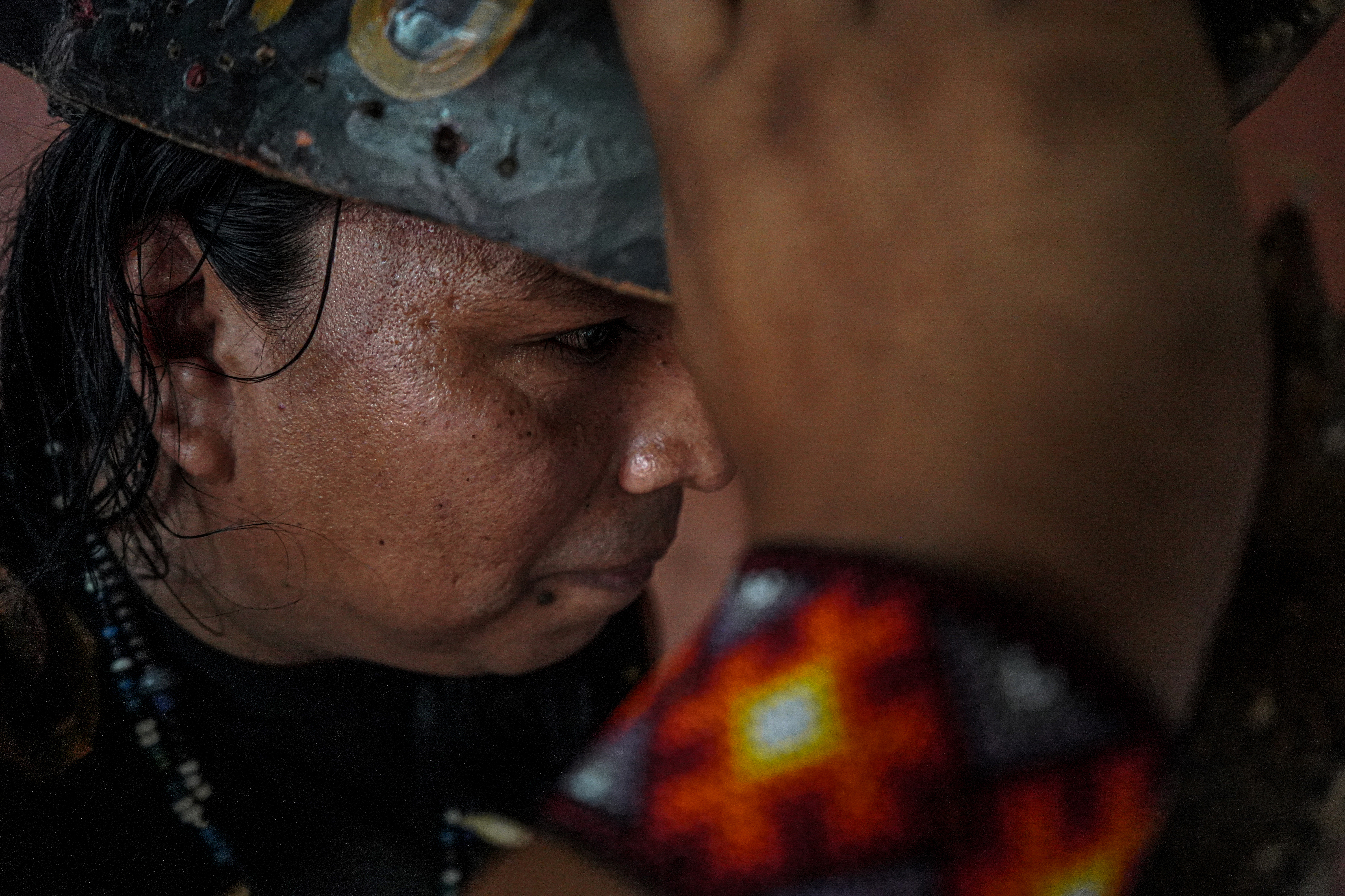 A close-up photo of Melvin Gonzalez, 42, at his home and mask-making workshop.