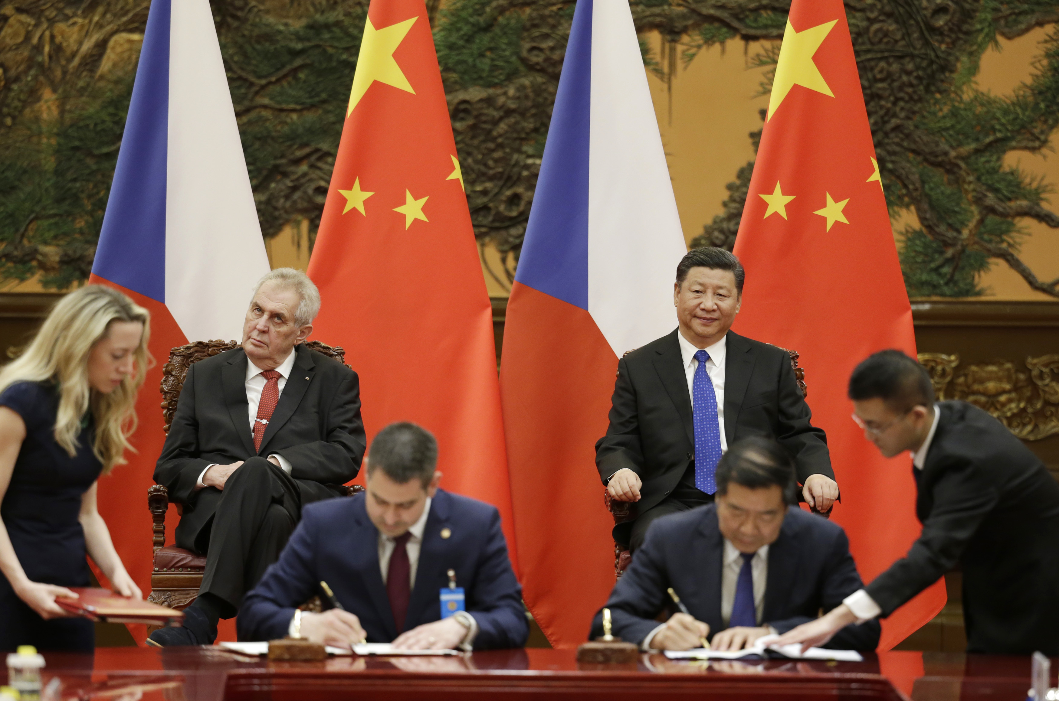 Czech President Milos Zeman, back left, and Chinese President Xi Jinping, back right, attend a signing ceremony at the Great Hall of the People in Beijing