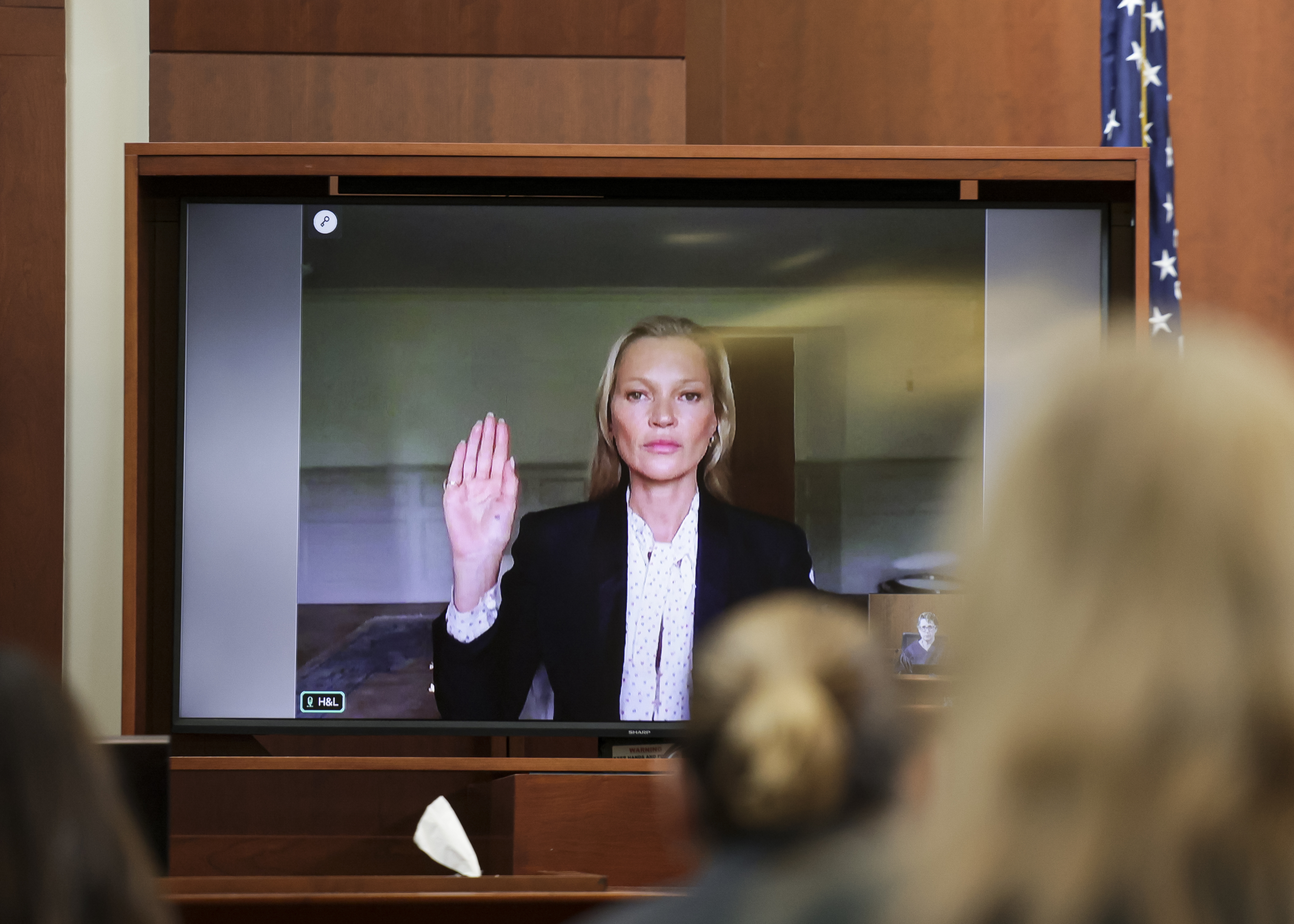 Model Kate Moss, a former girlfriend of actor Johnny Depp, testifies via video link at the Fairfax County Circuit Courthouse in Fairfax, Va., Wednesday, May 25, 2022. Depp sued his ex-wife Amber Heard for libel in Fairfax County Circuit Court after she wrote an op-ed piece in The Washington Post in 2018 referring to herself as a "public figure representing domestic abuse." (Evelyn Hockstein/Pool photo via AP)