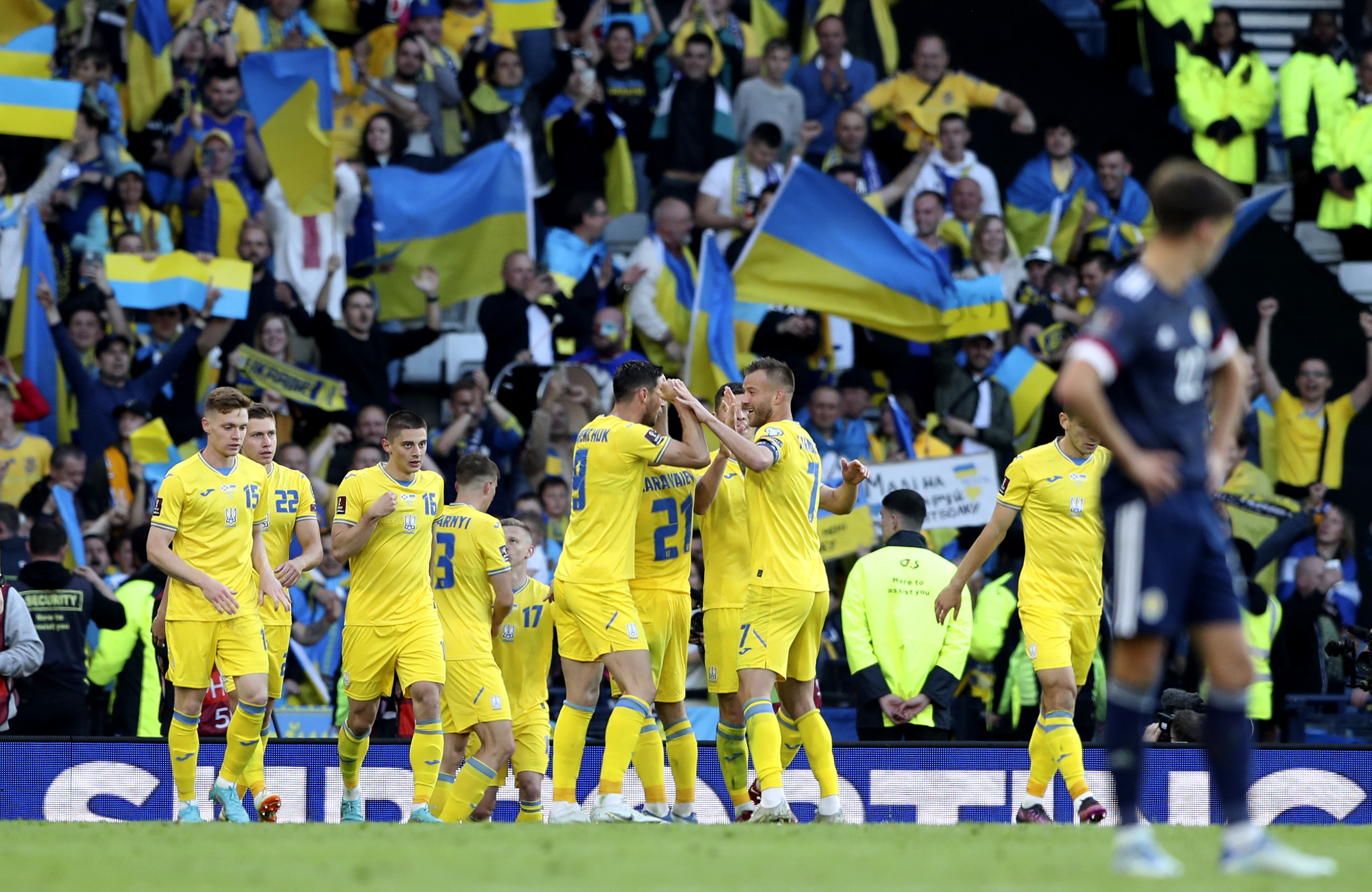 Ukraine's Roman Yaremchuk celebrates with teammates after scoring his side's second goal during the World Cup 2022 qualifying play-off soccer match between Scotland and Ukraine at Hampden Park stadium in Glasgow, Scotland on Wednesday, June 1, 2022 [Scott Heppell/AP]