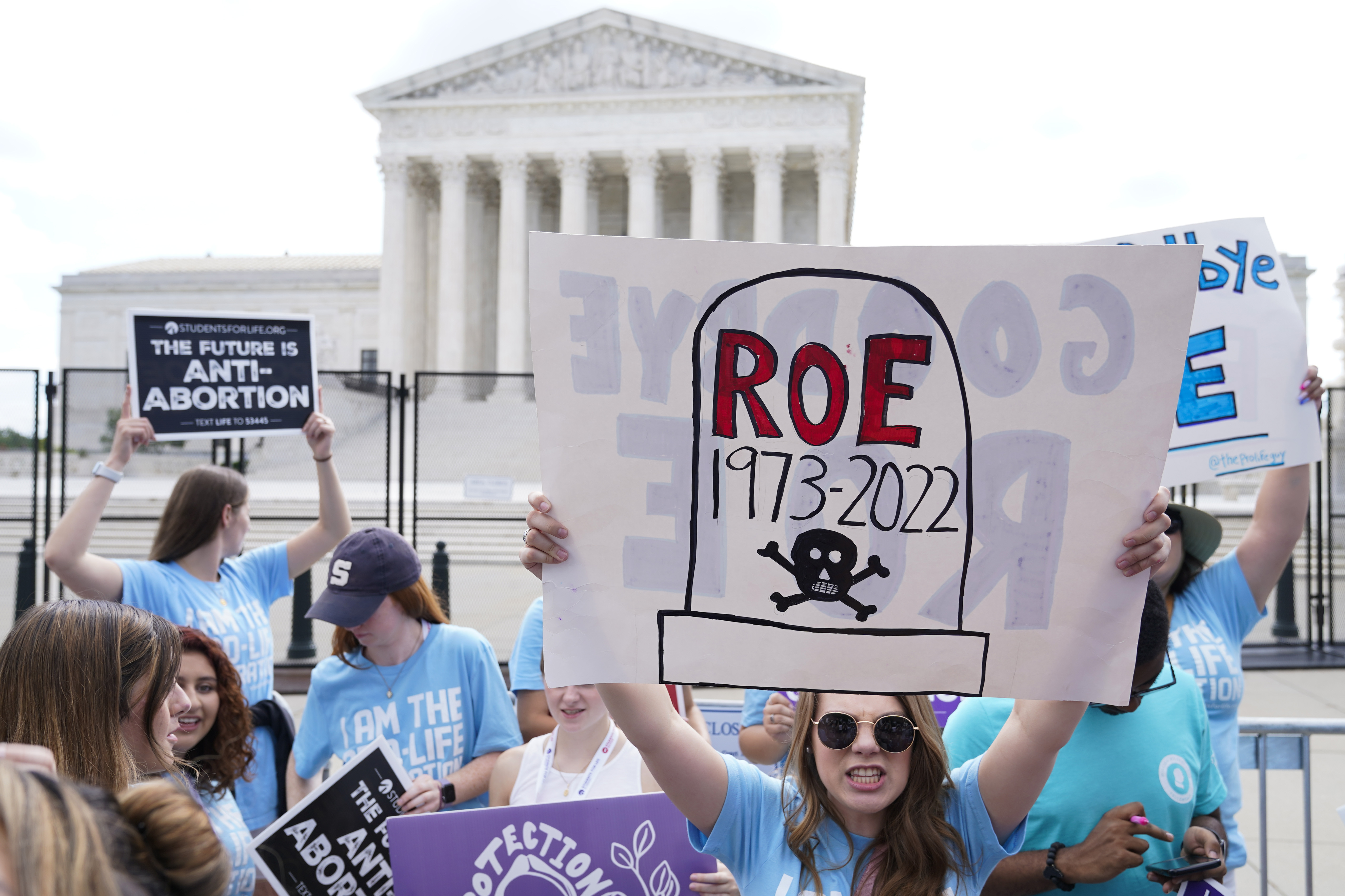 Demonstrators protest against abortion outside the Supreme Court
