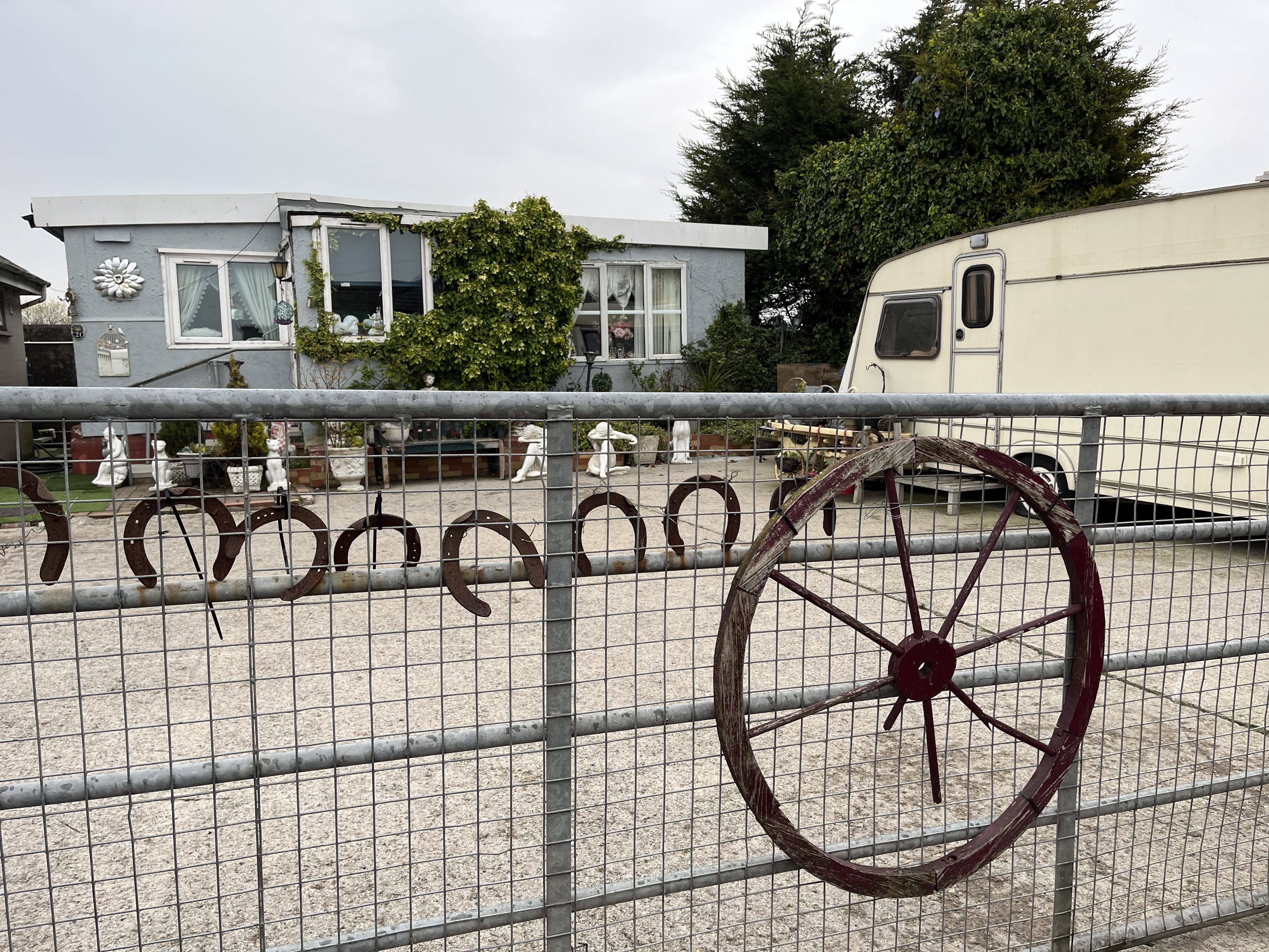 A gate decorated with traditional Traveller wheels