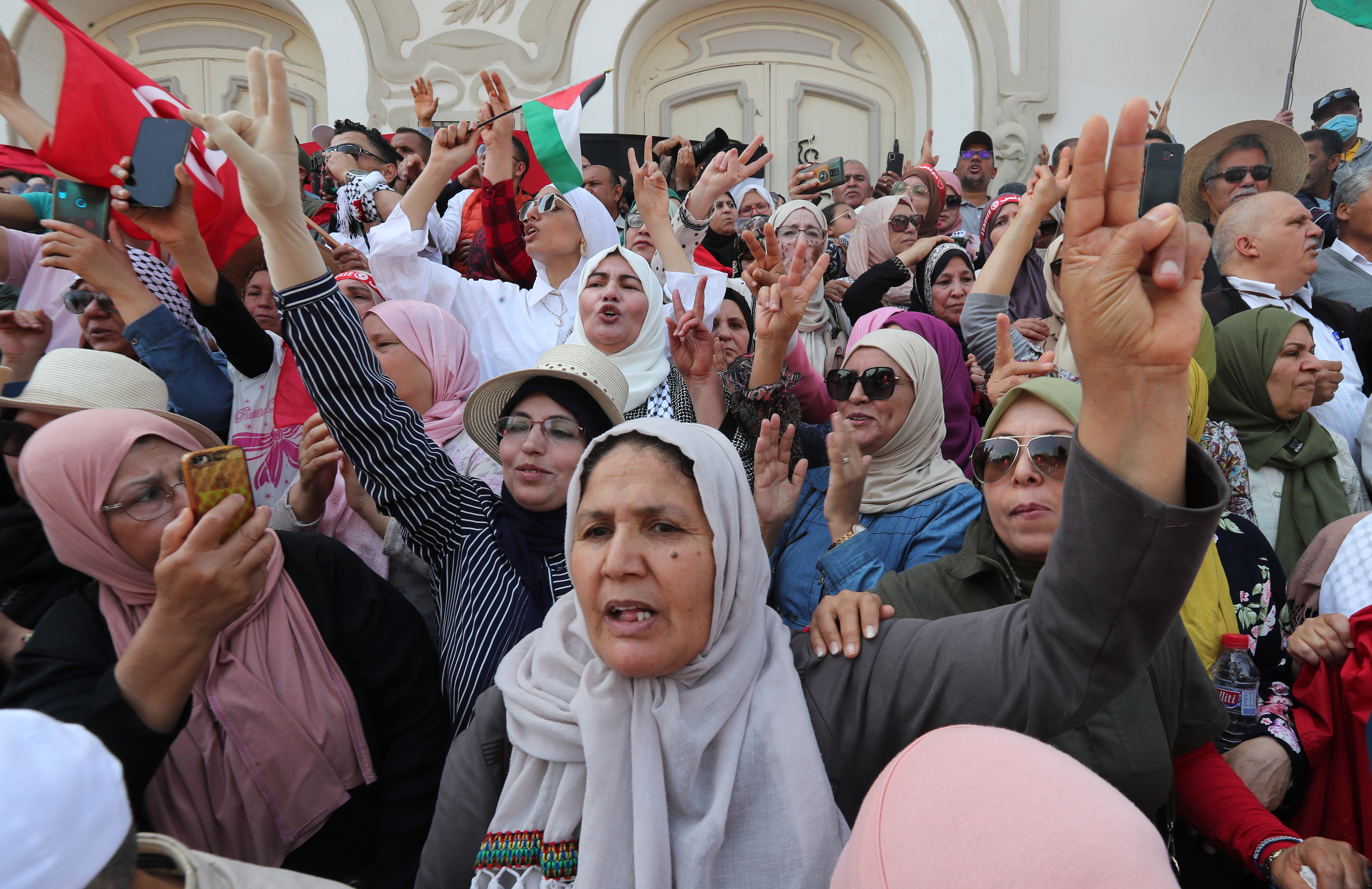 Tunisians shout slogans during a demonstration against Tunisian President Kais Saied 