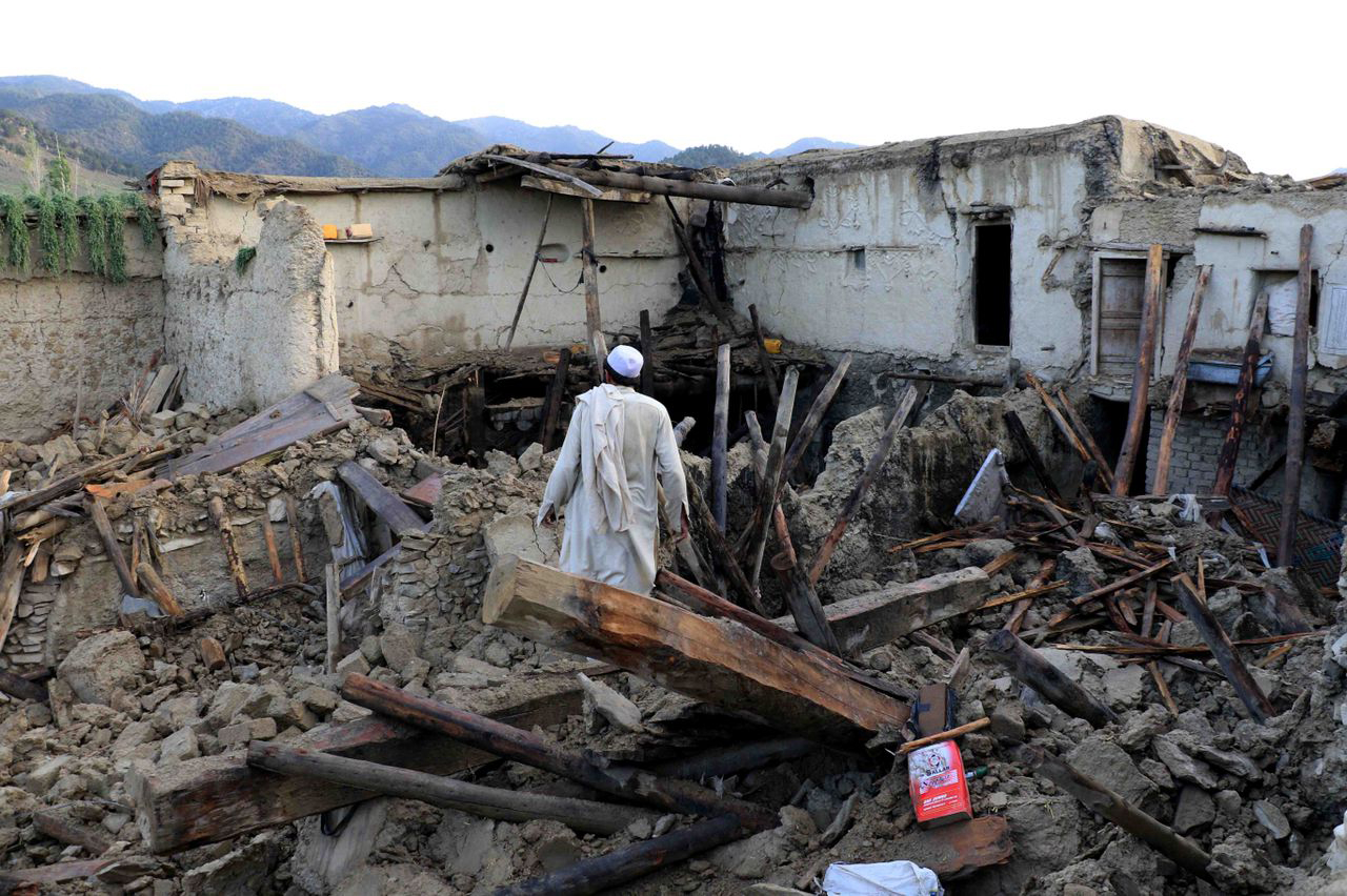 People affected by earthquake wait for relief in Gayan village in Paktia province.