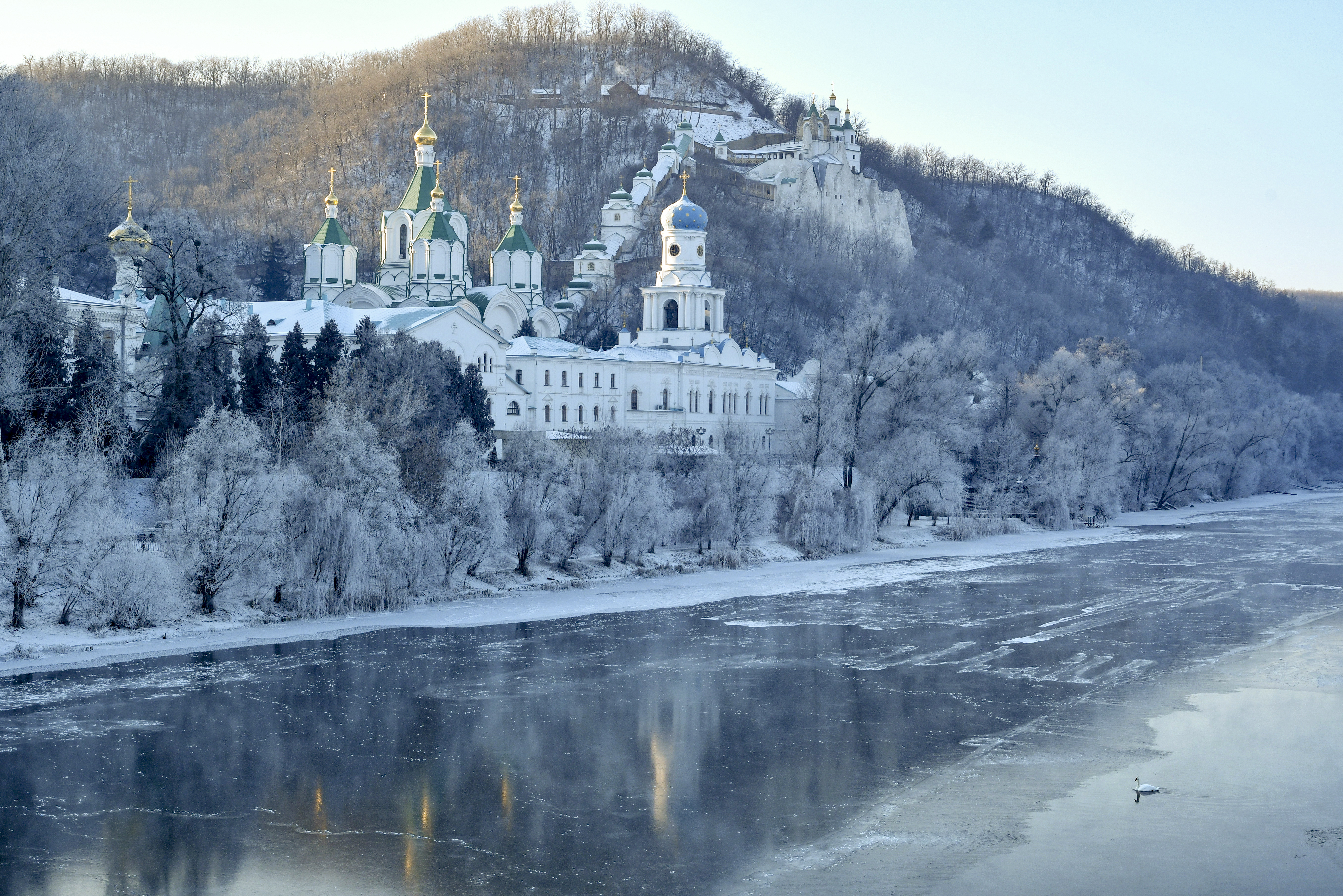 The Holy Mountains Lavra of the Holy Dormition, a major Orthodox Christian monastery, during winter sunrise on the steep right bank of the Seversky Donets River near the town of Sviatohirsk in Donetsk region of eastern Ukraine