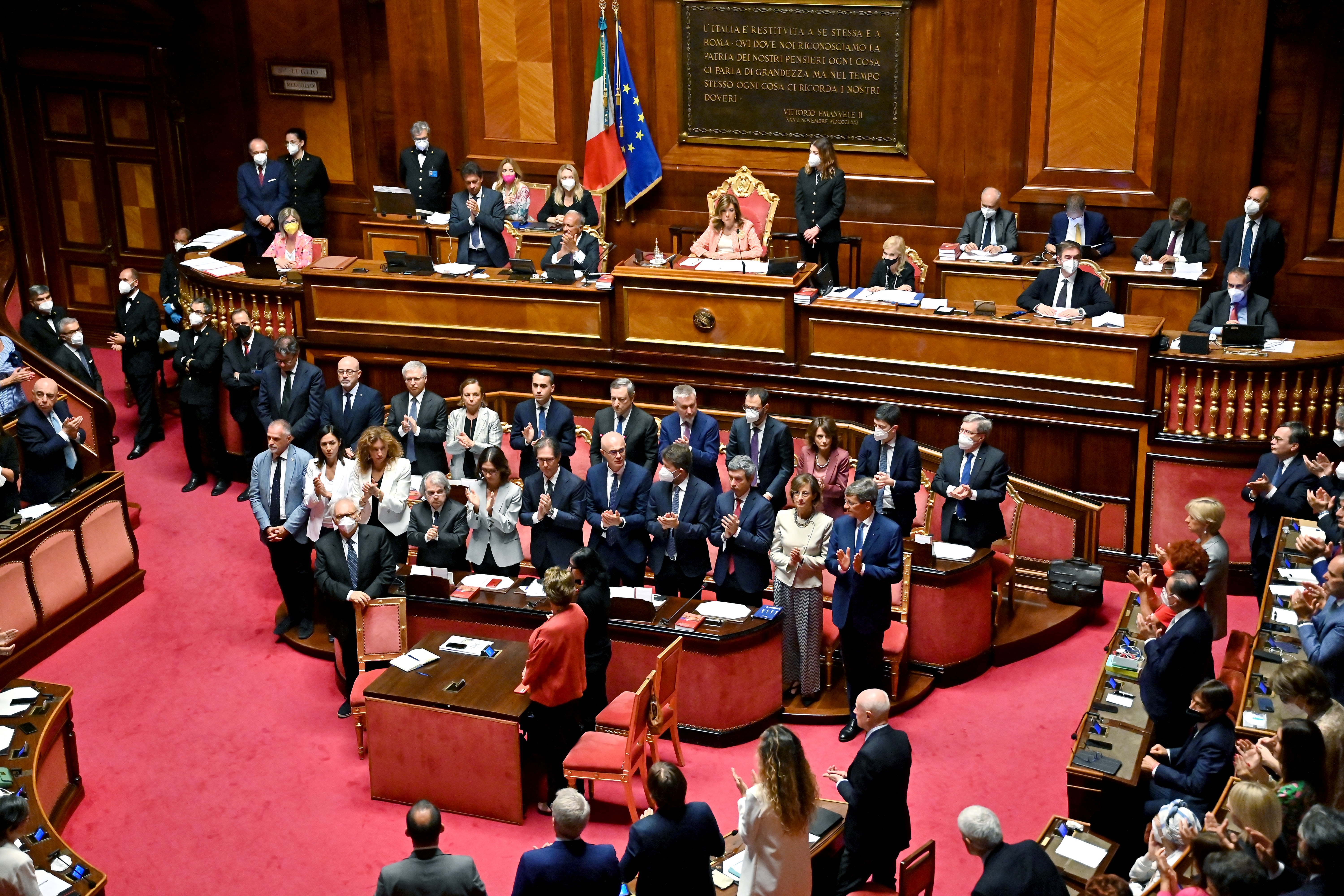 Ministers and senators applaud Italy's Prime Minister Mario Draghi