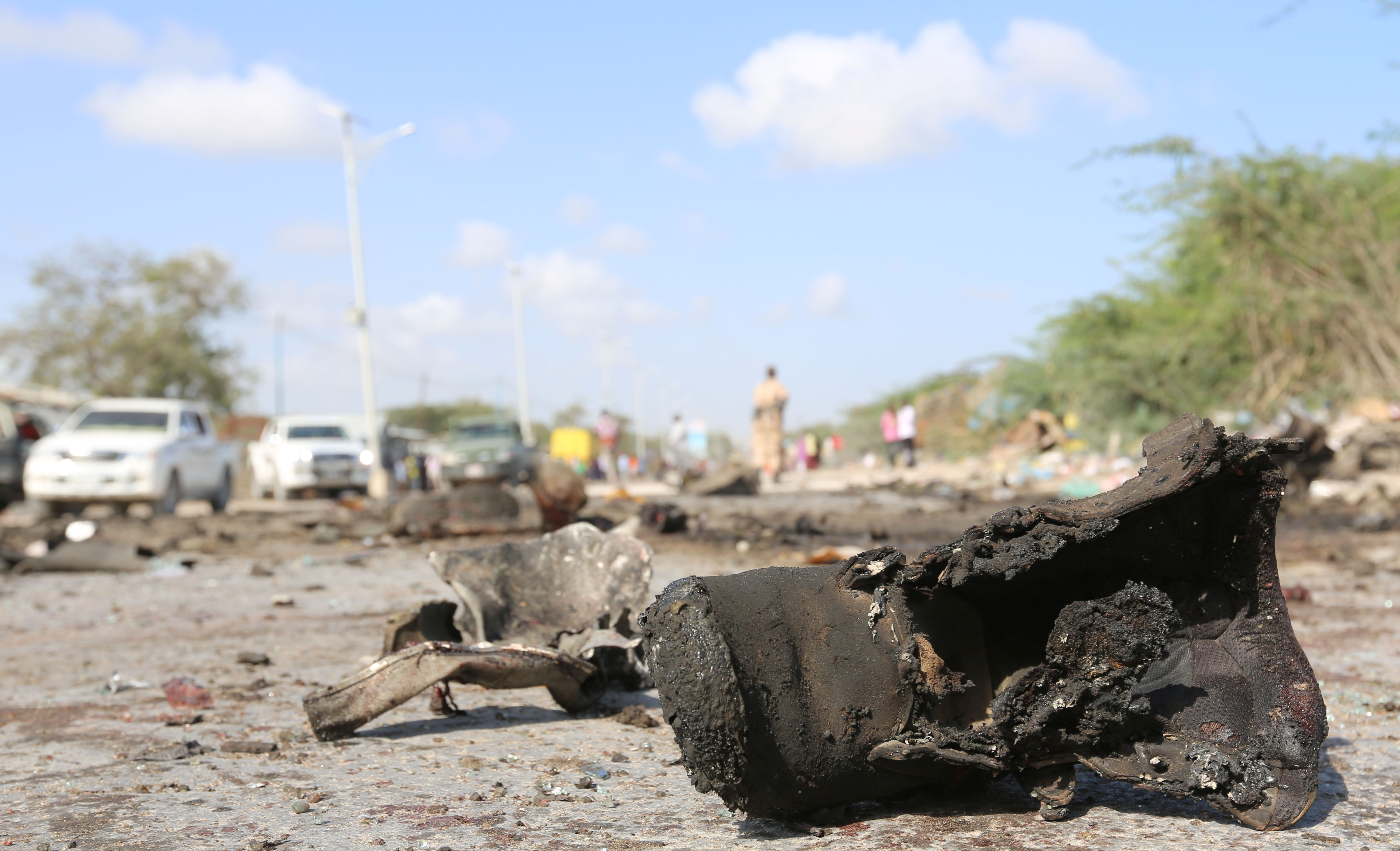 A military boot is seen at the scene of a suicide car bomb attack by al Shabaab in Somalia's capital Mogadishu