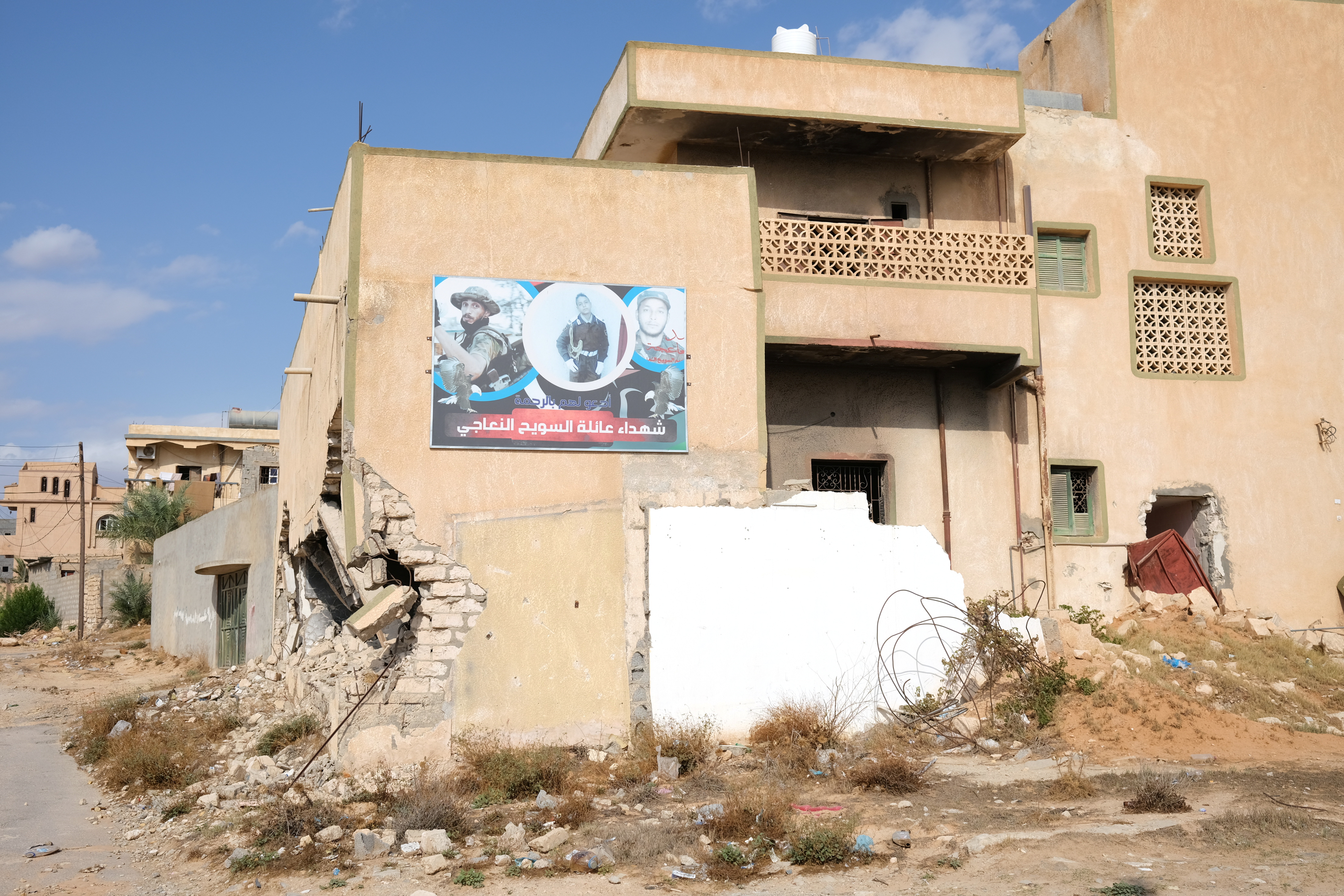 A destroyed house of victim of Kaniyat group killings is seen in Tripoli