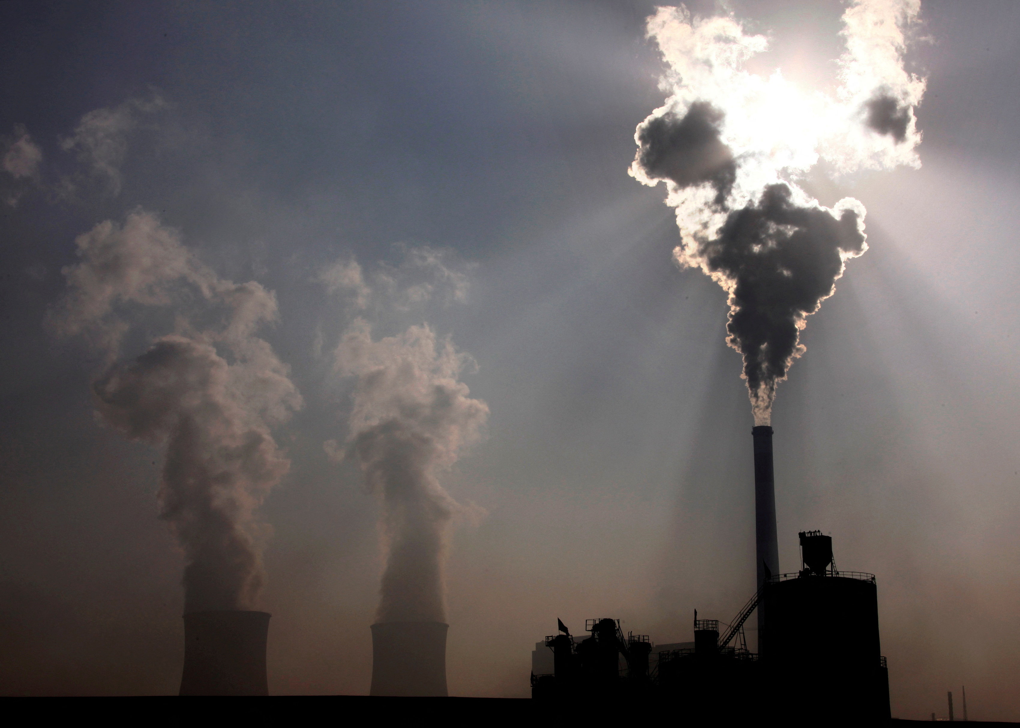 A coal plant behind a factory in Baotou, China.