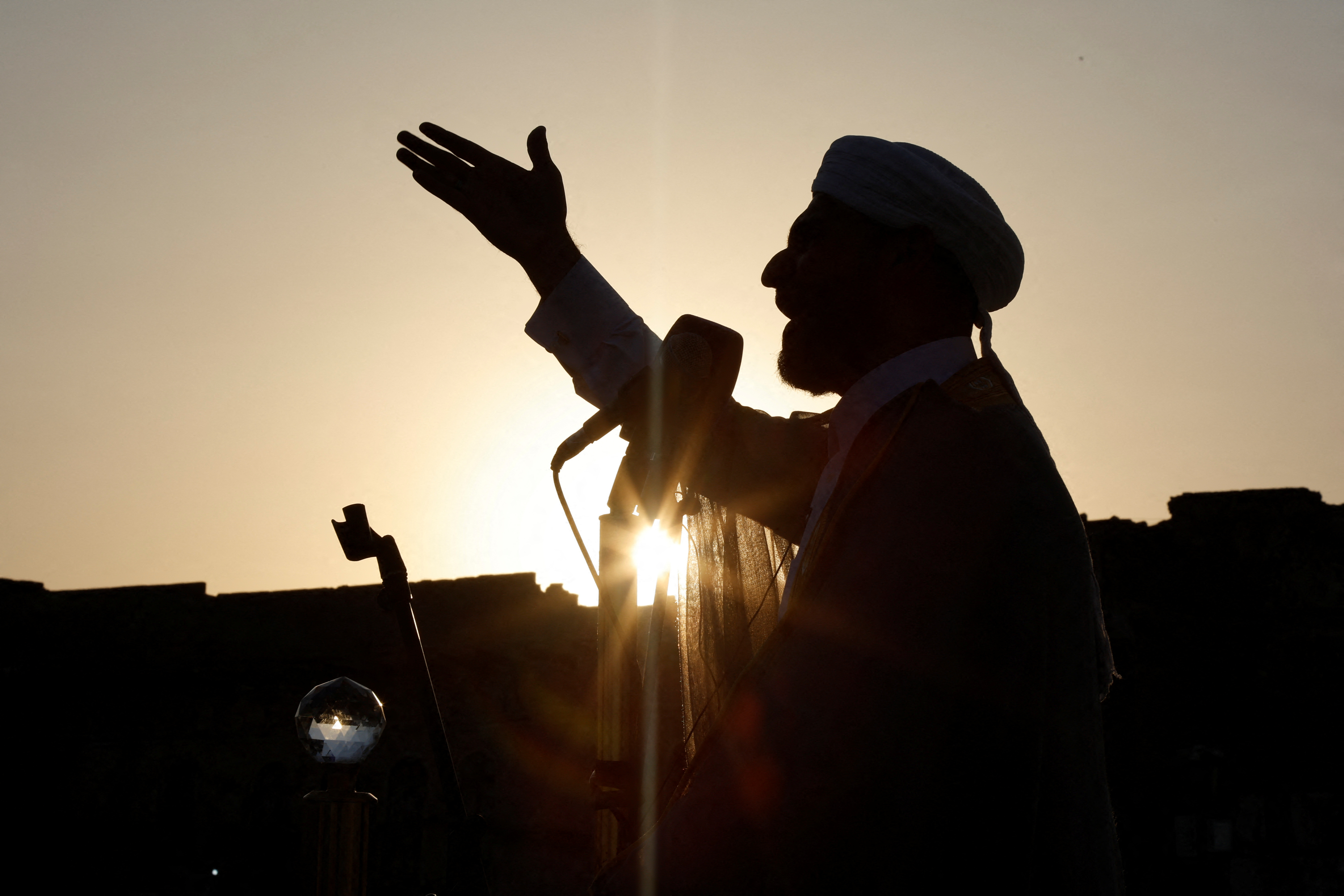 An imam gives a sermon for the Eid al-Adha prayer at Al-Nuri mosque in Mosul, Iraq