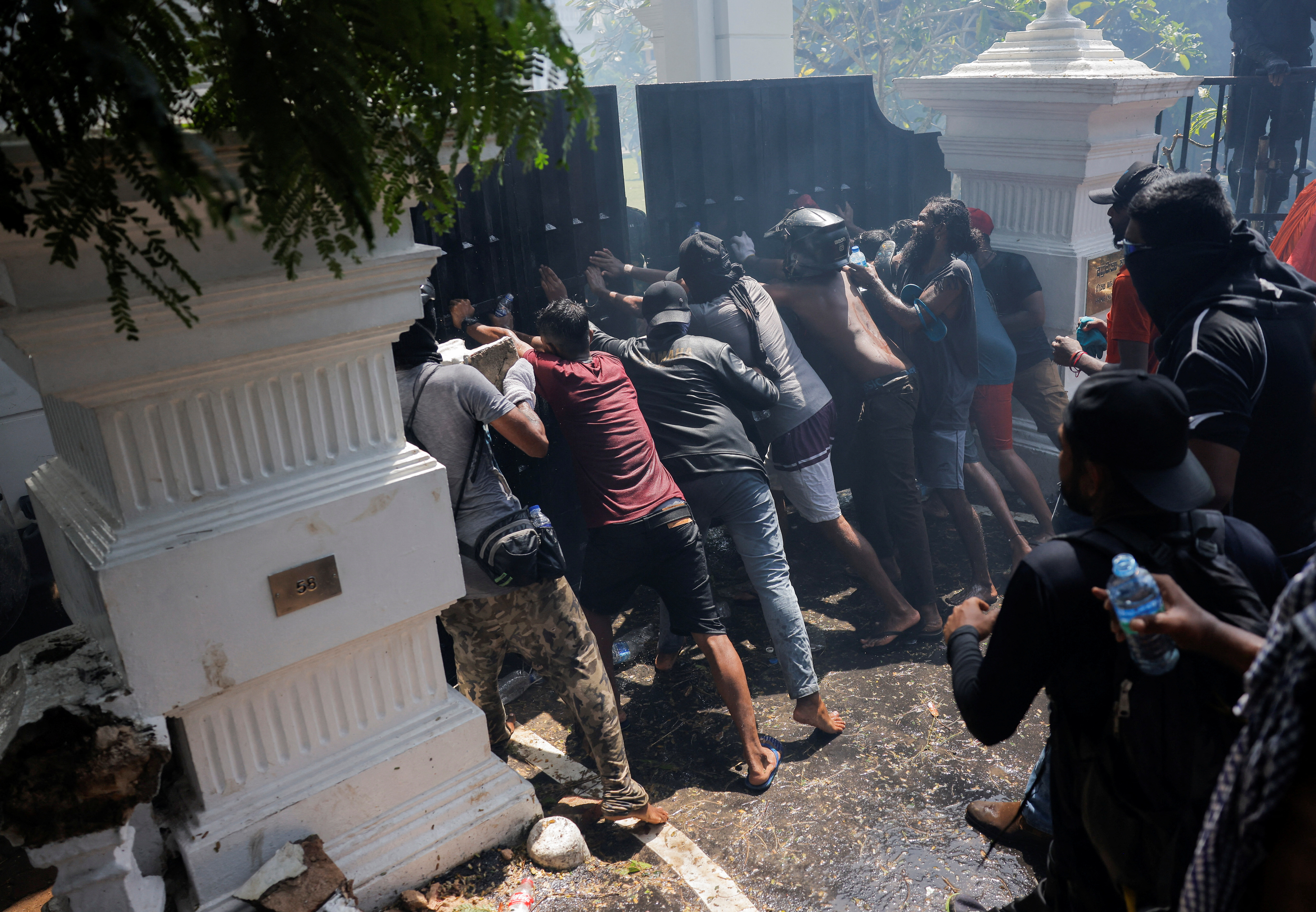 Demonstrators break the gate of Sri Lankan Prime Minister Ranil Wickremasinghe's office
