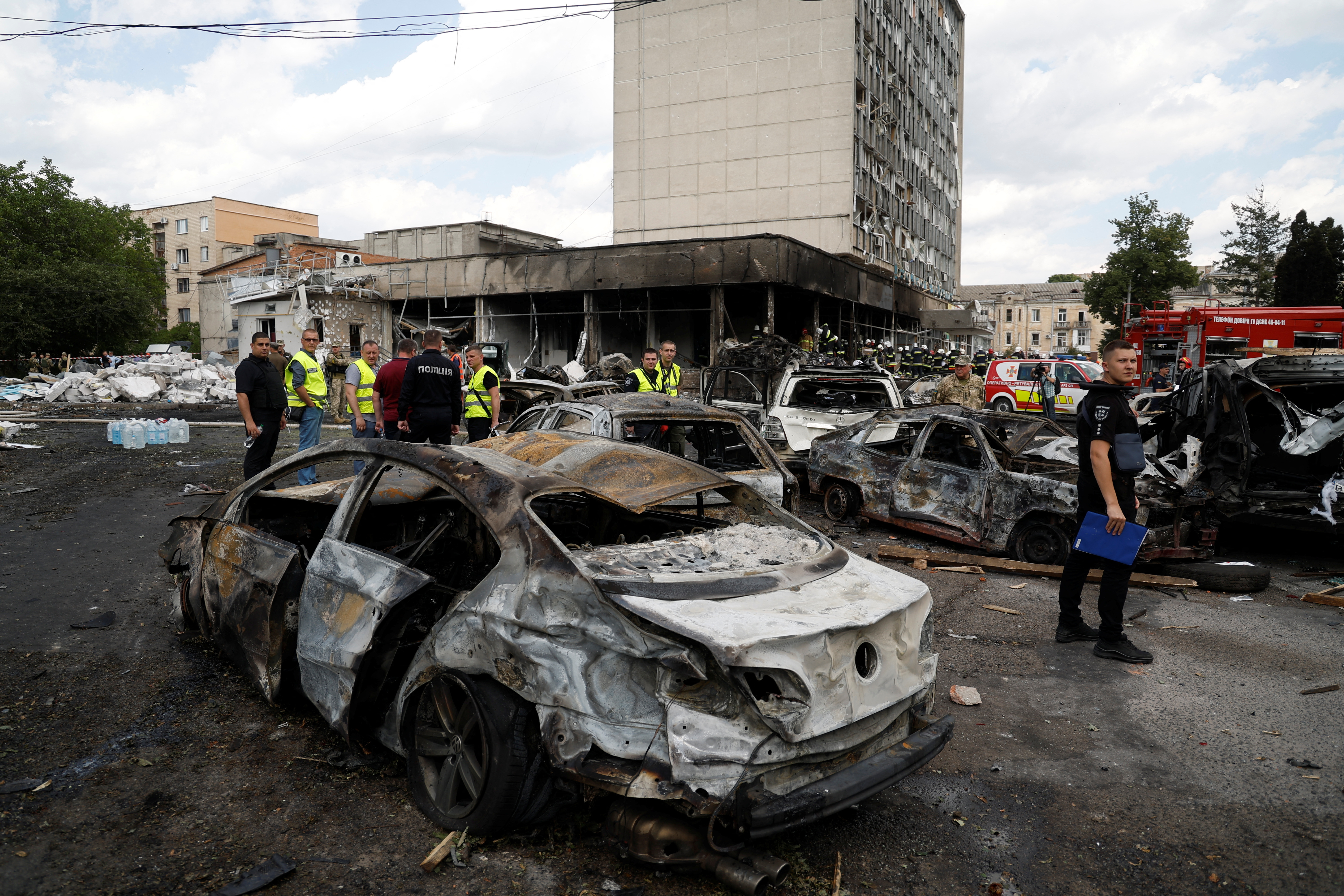 A burned-out car sits in front of a damaged building after a missile attack in Vinnytsia, Ukraine.