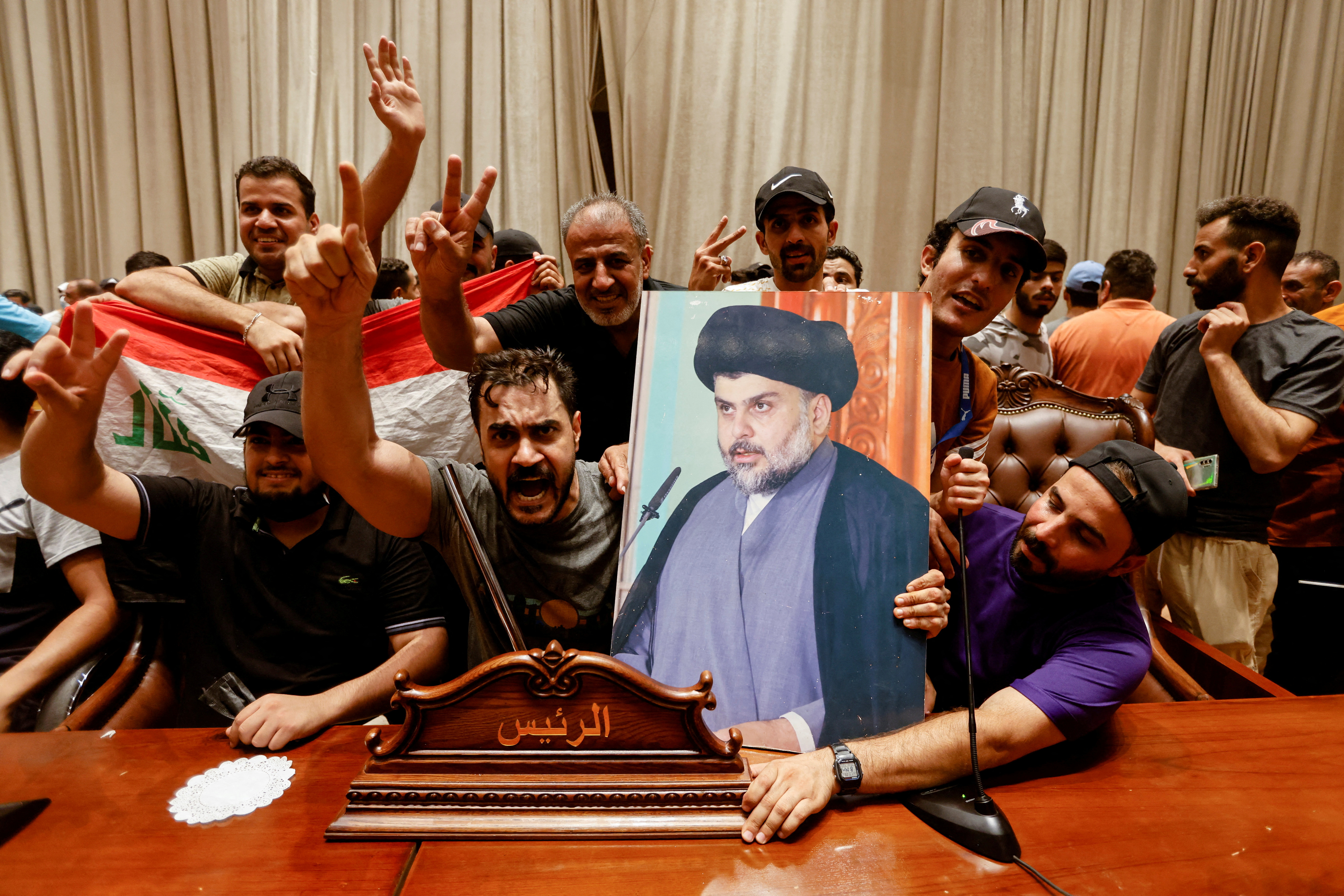 Supporters of the Iraqi cleric Moqtada Sadr gather inside the Iraqi parliament