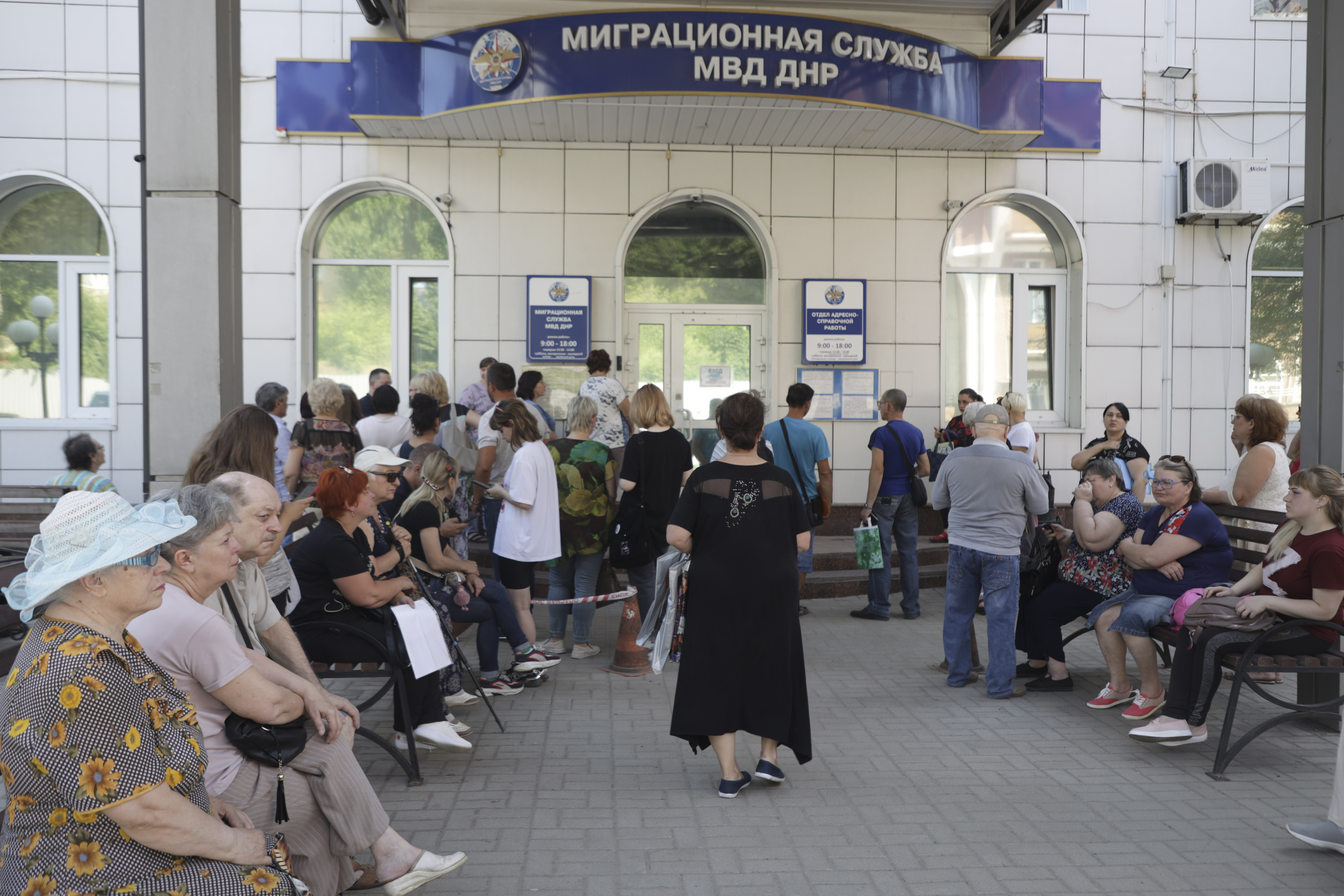 Residents of Donetsk stand in line at a Migration Service office to receive a passport of a citizen of the Russian Federation, in Donetsk, in an area controlled by Russian-backed separatist forces, eastern Ukraine