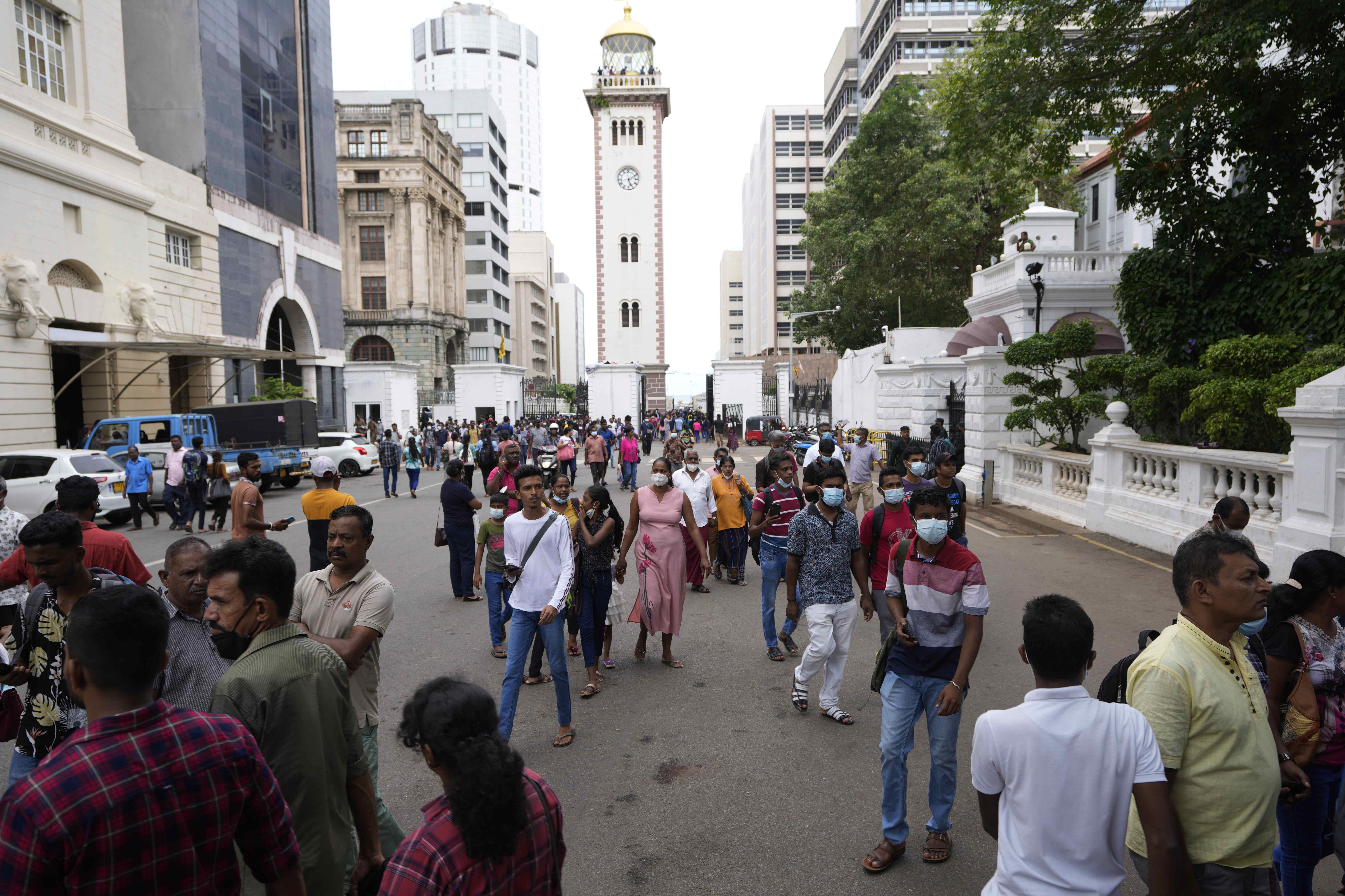 People arrive at President Gotabaya Rajapaksa's official residence