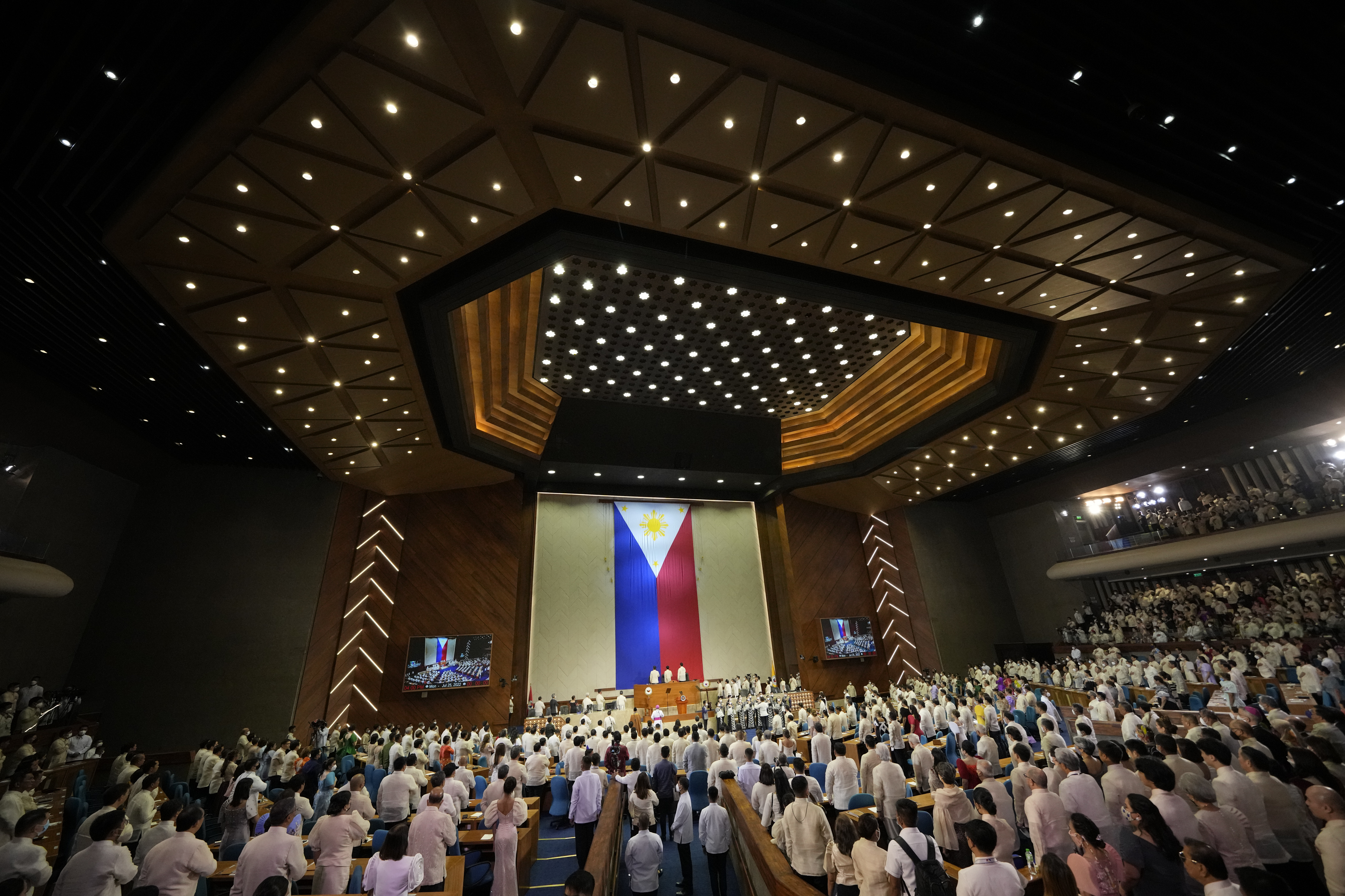 Philippine President Ferdinand Marcos Jr. joins prayers before the start of his first state of the nation address in, Quezon city, Philippines, Monday, July 25, 2022. Marcos Jr. delivers his first state of the nation address Monday with staunch political capital after a landslide victory but hounded by history as the son of an ousted dictator and multiple dilemmas wrought by the coronavirus pandemic and global fallout from the Ukraine war. 