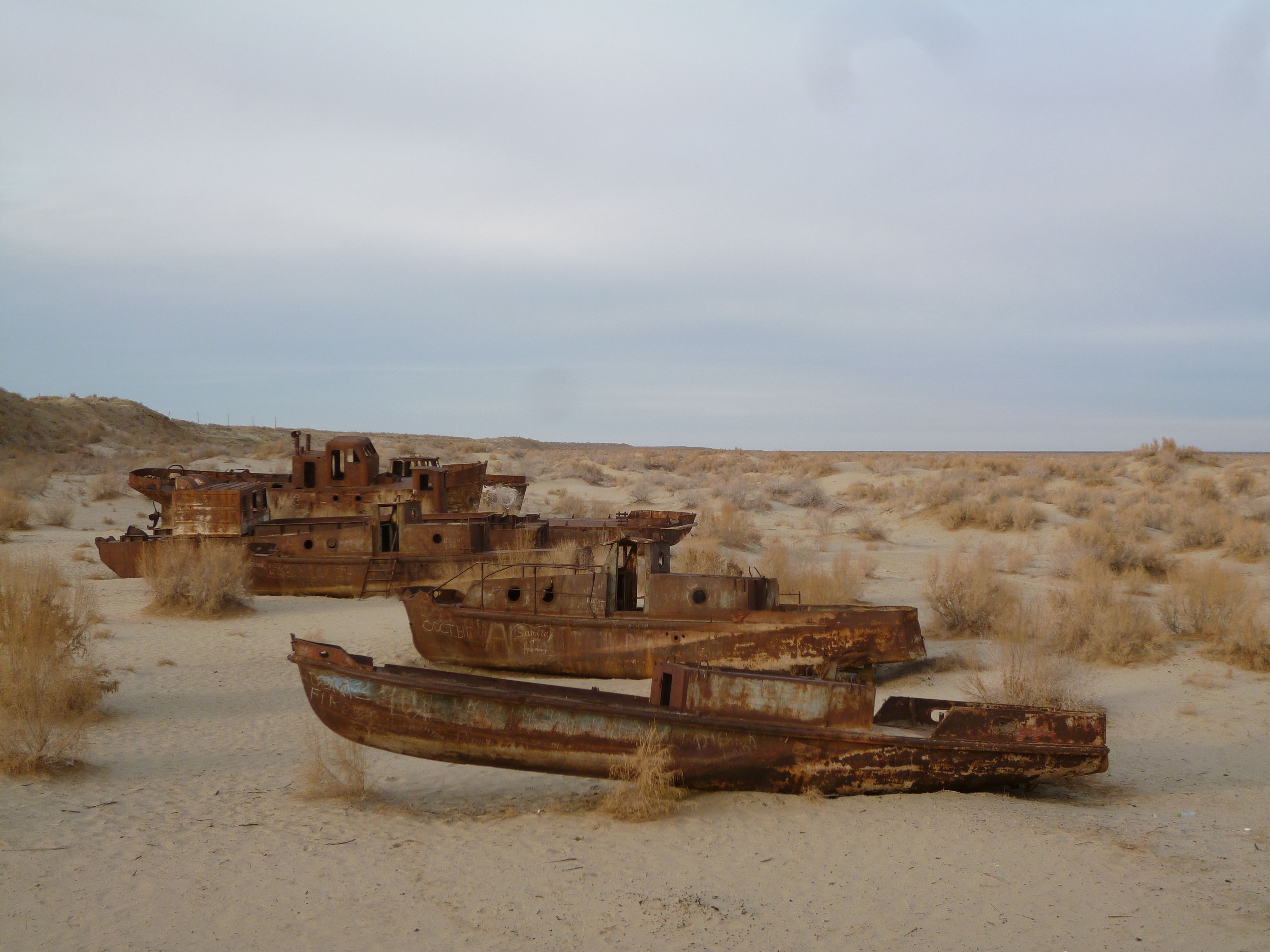 Fishing boats in the sands around former seaport Myunak