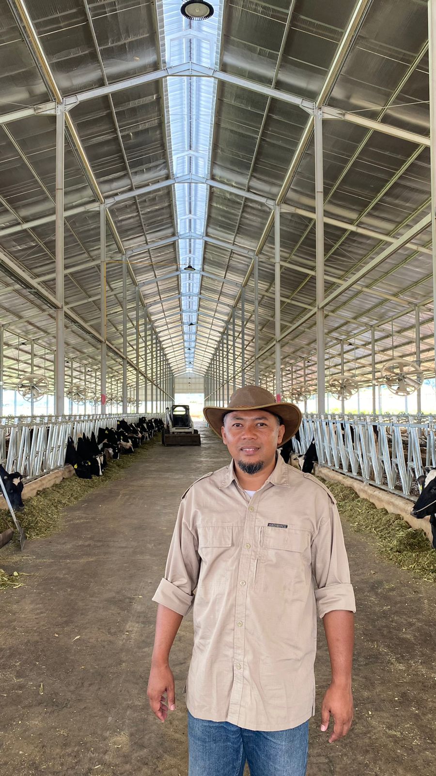 Joko Iriantono in a cow barn.