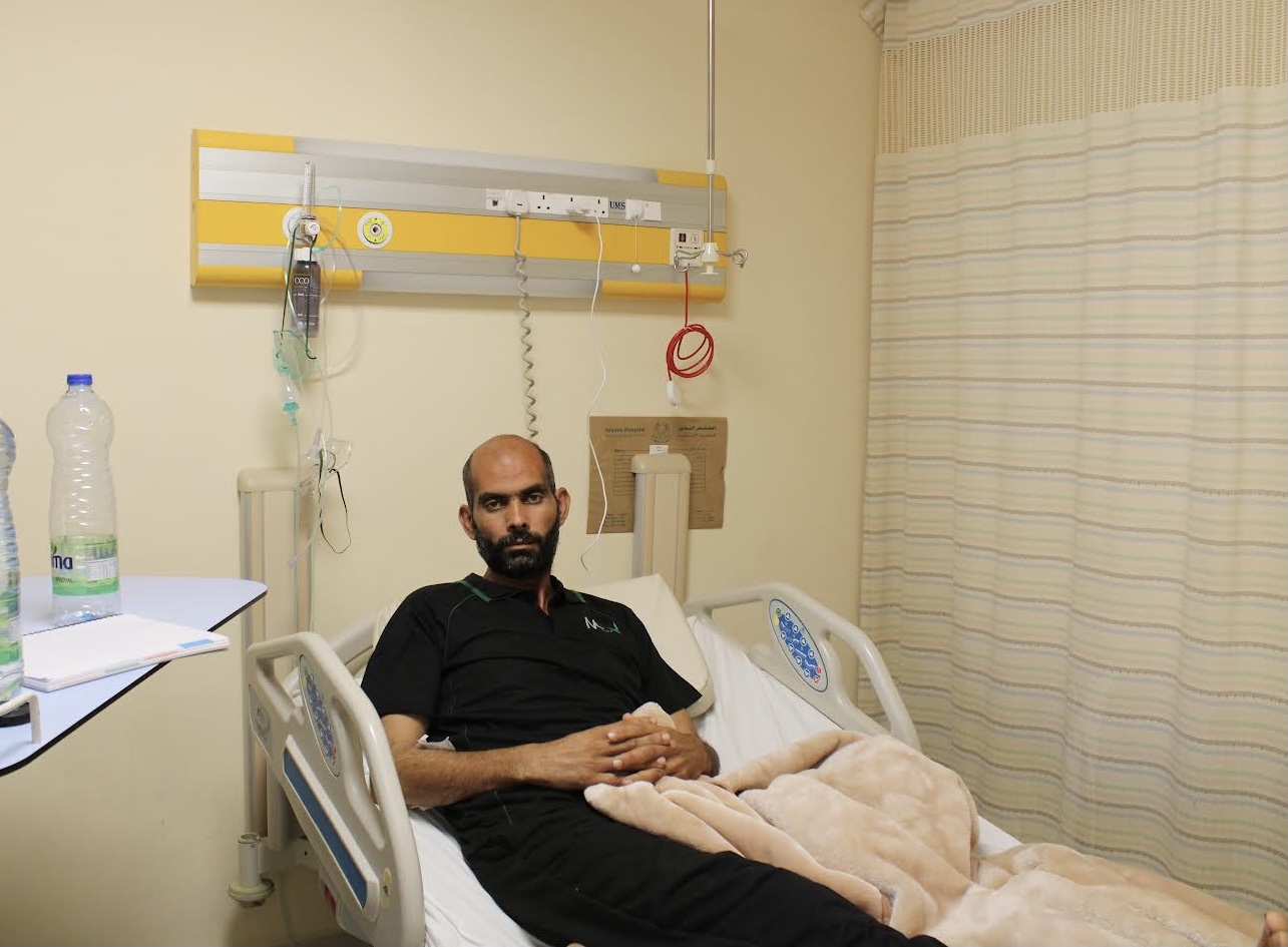 Mohammad Fathi Attato, survivor of the Aqaba port leak, lies in a hospital bed