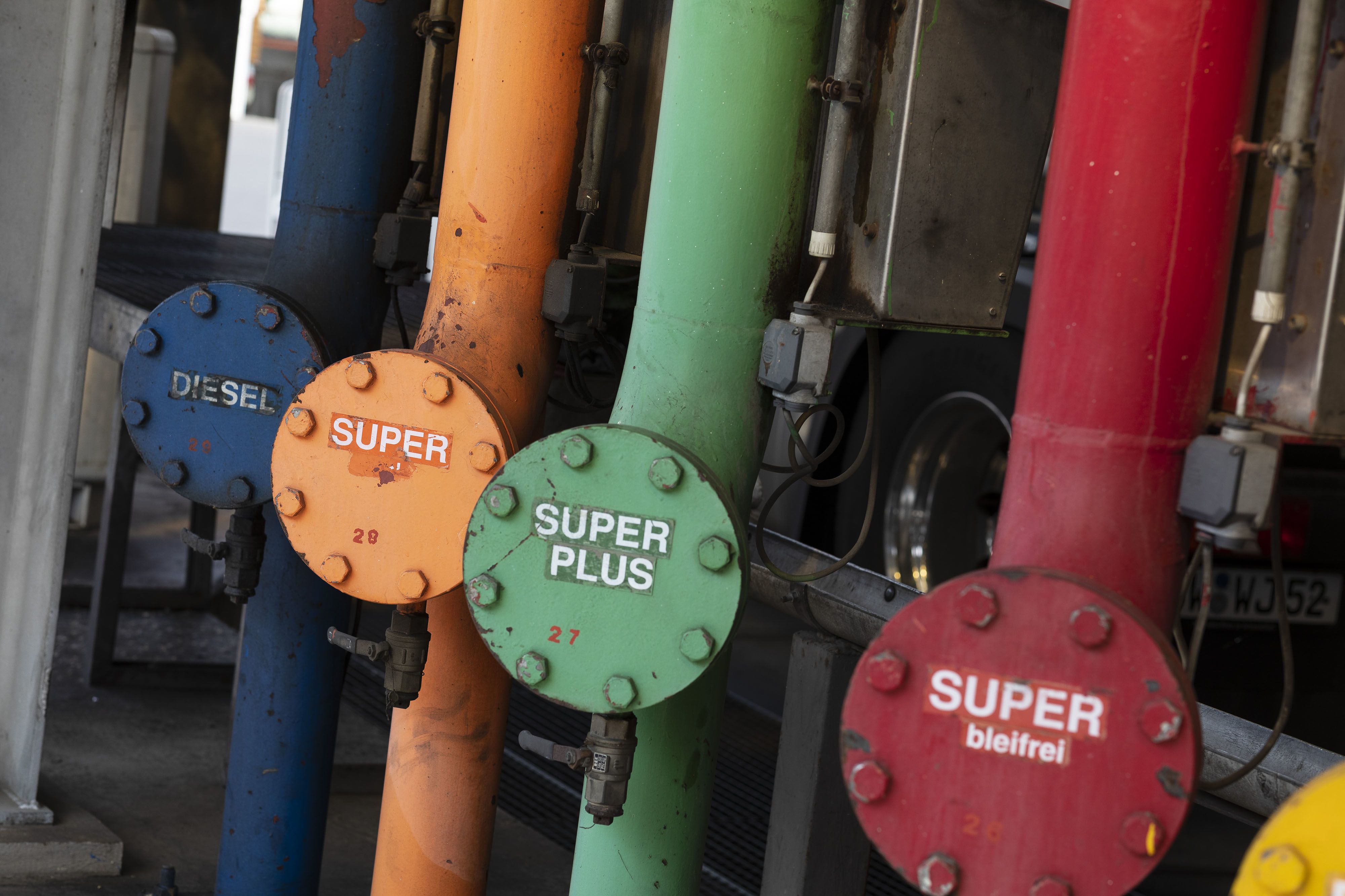 A row of colored petroleum outlet pipes stand at the Erik Walther GmbH oil terminal on the River Rhine in Schweinfurt, Germany.