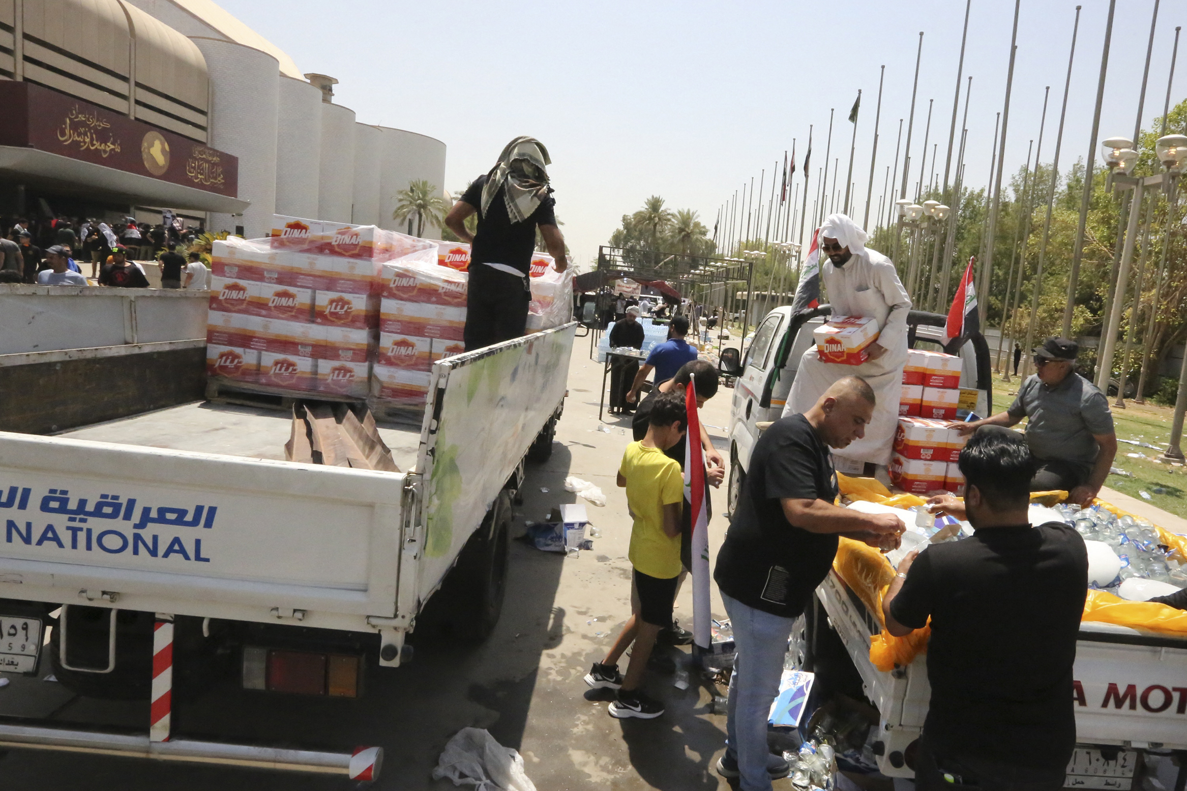 Volunteers distribute mineral water to the protesters