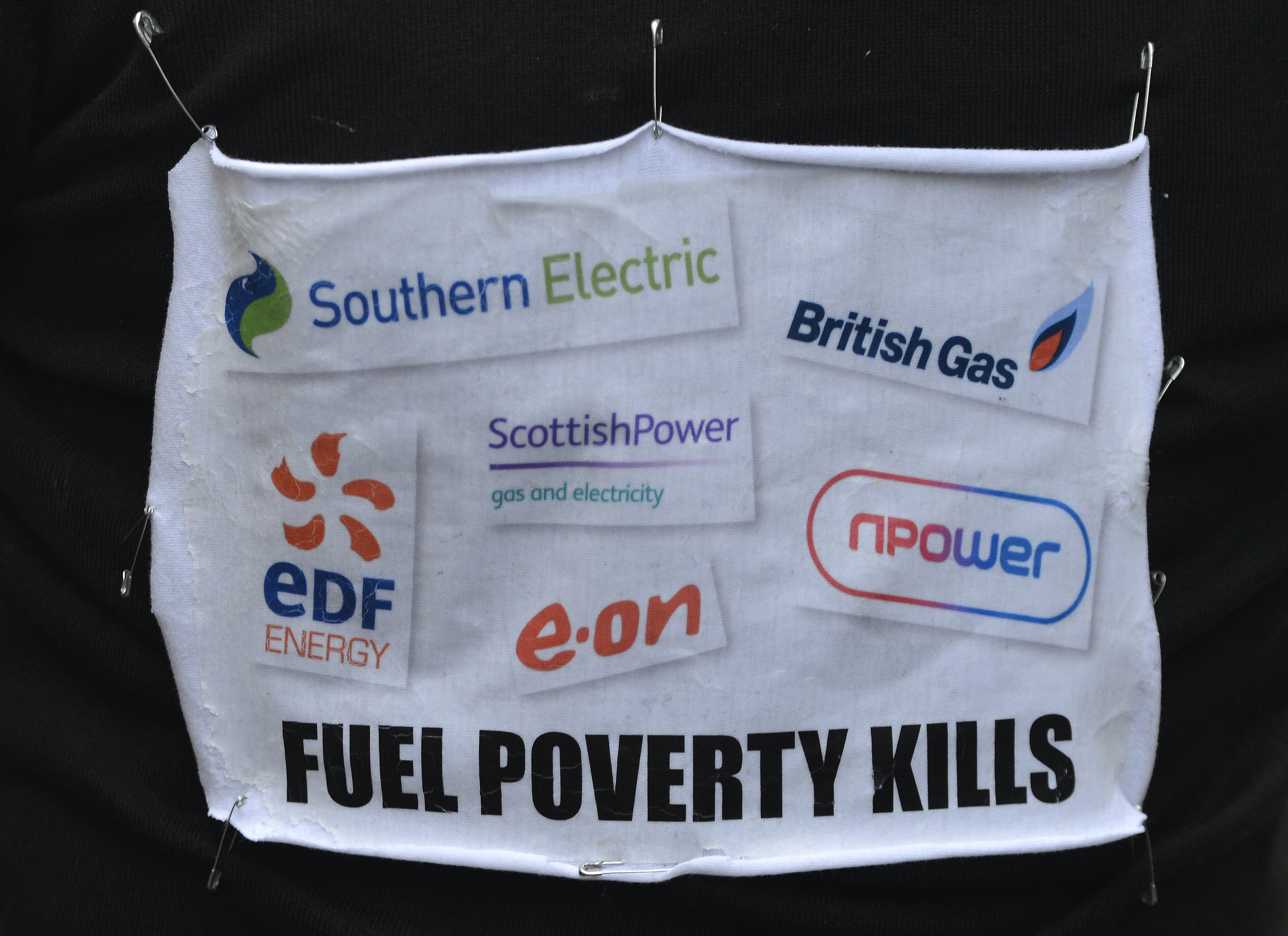 banner a march to the headquarters of energy company during a protest in London