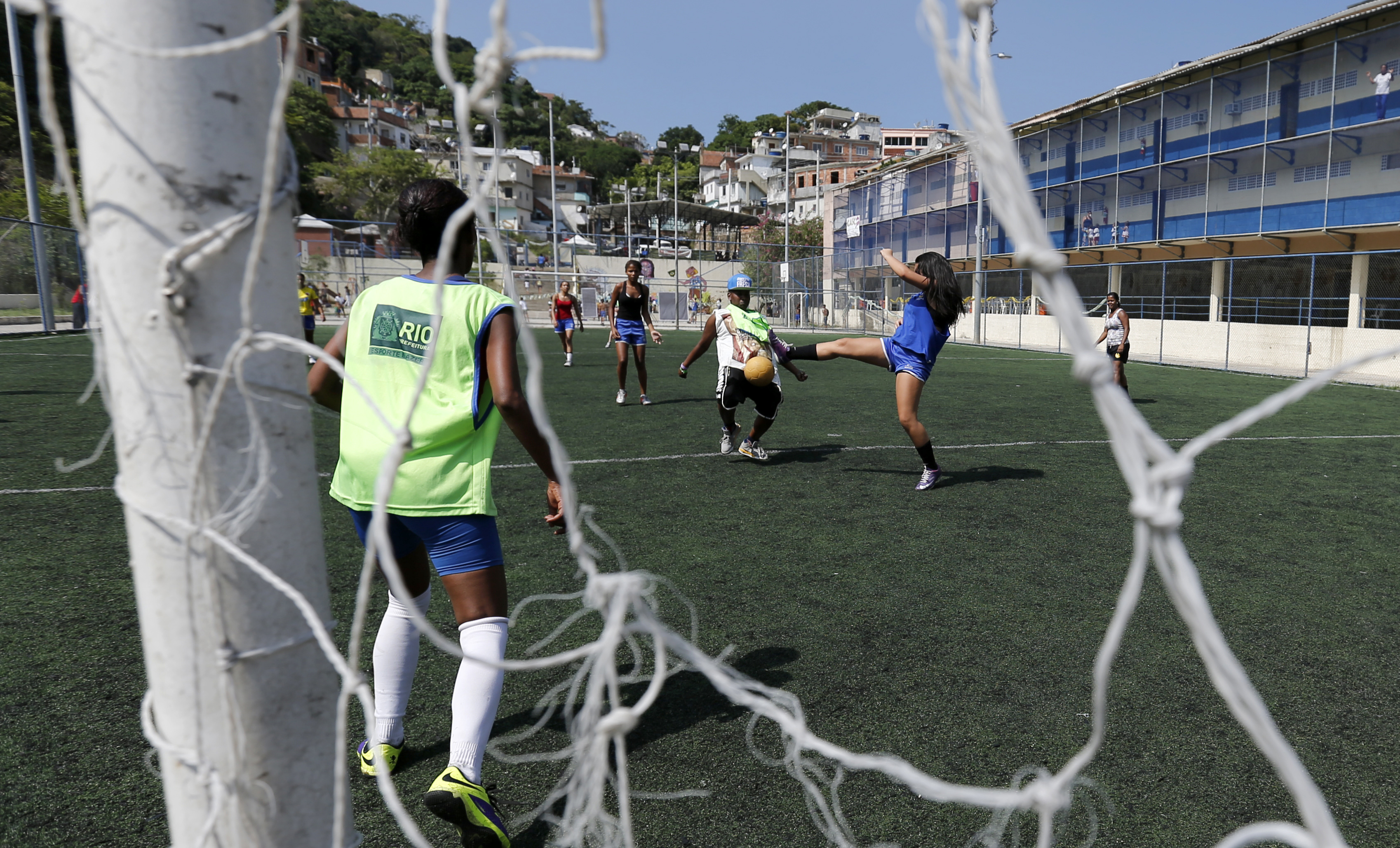 Children from different countries play football during a friendly match ahead of the Street Child World Cup at the Vidigal slum in Rio de Janeiro, Brazil.