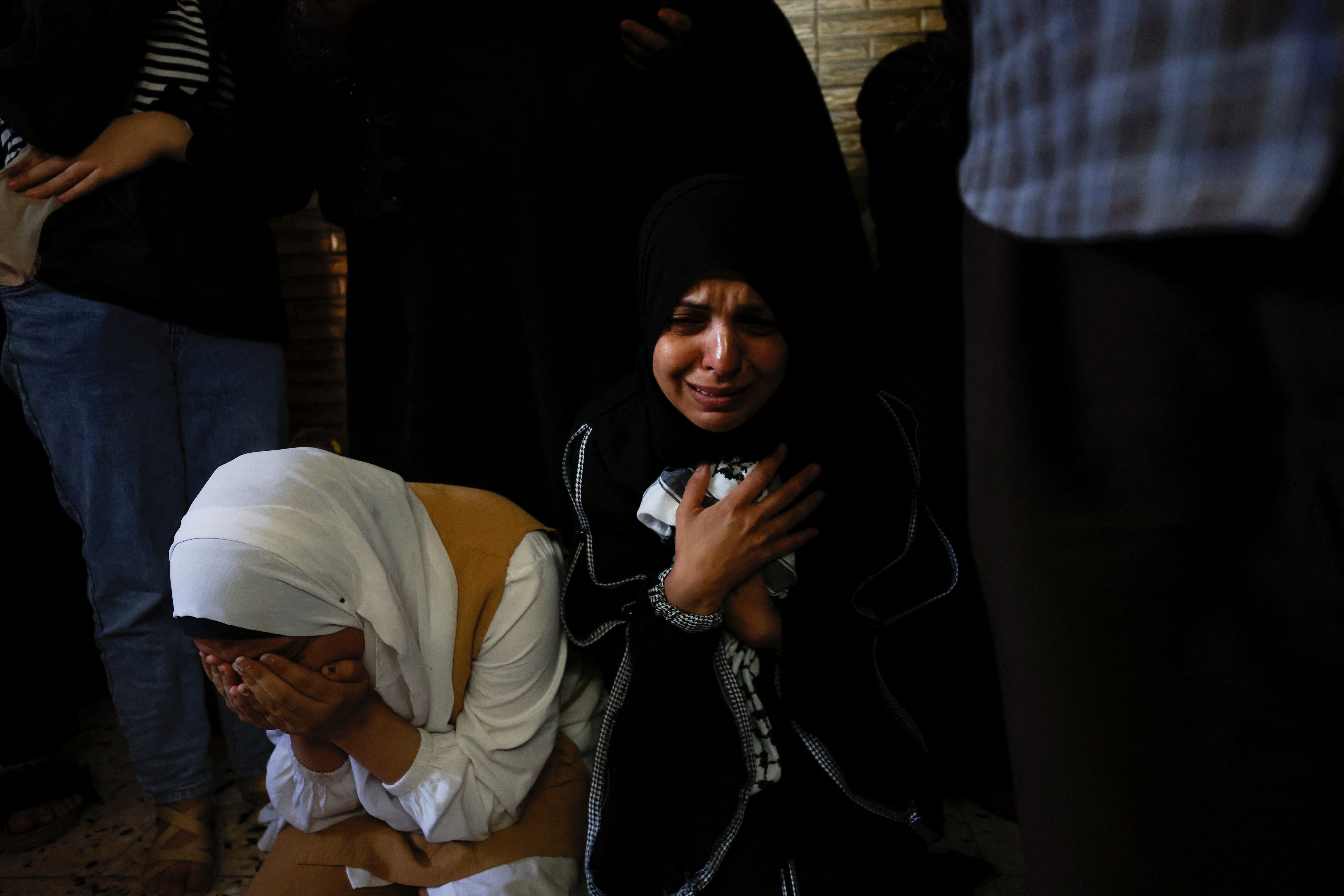 Mourners attend the funeral of Palestinian Dirar Al-Kafrini who was killed by Israeli forces