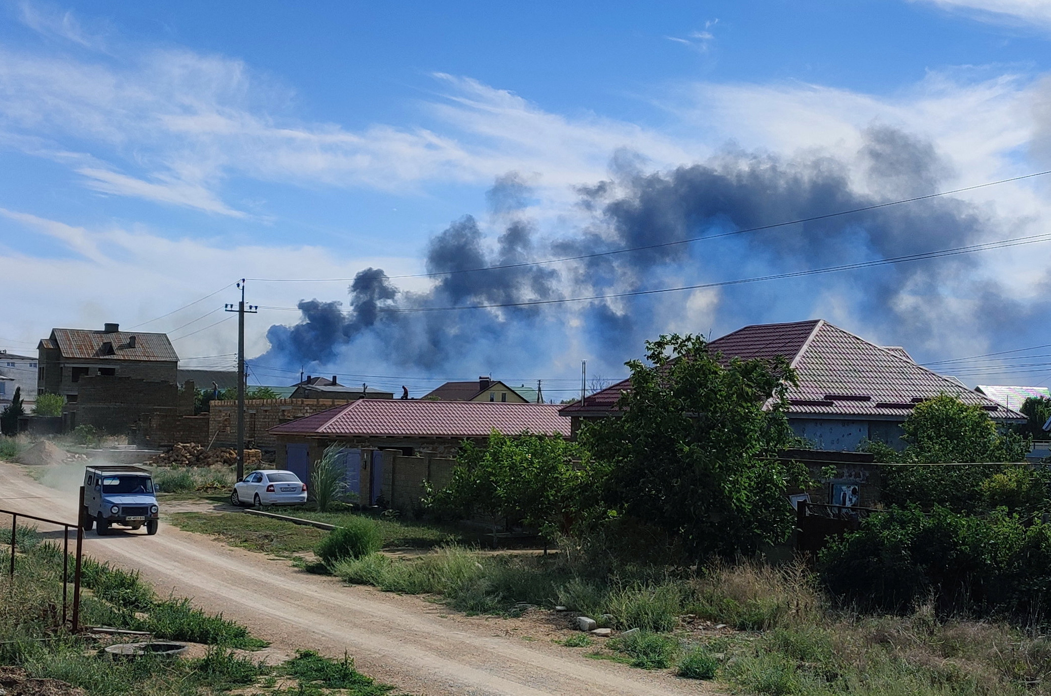 Smoke rises after explosions were heard from the direction of a Russian military airbase near Novofedorivka, Crimea