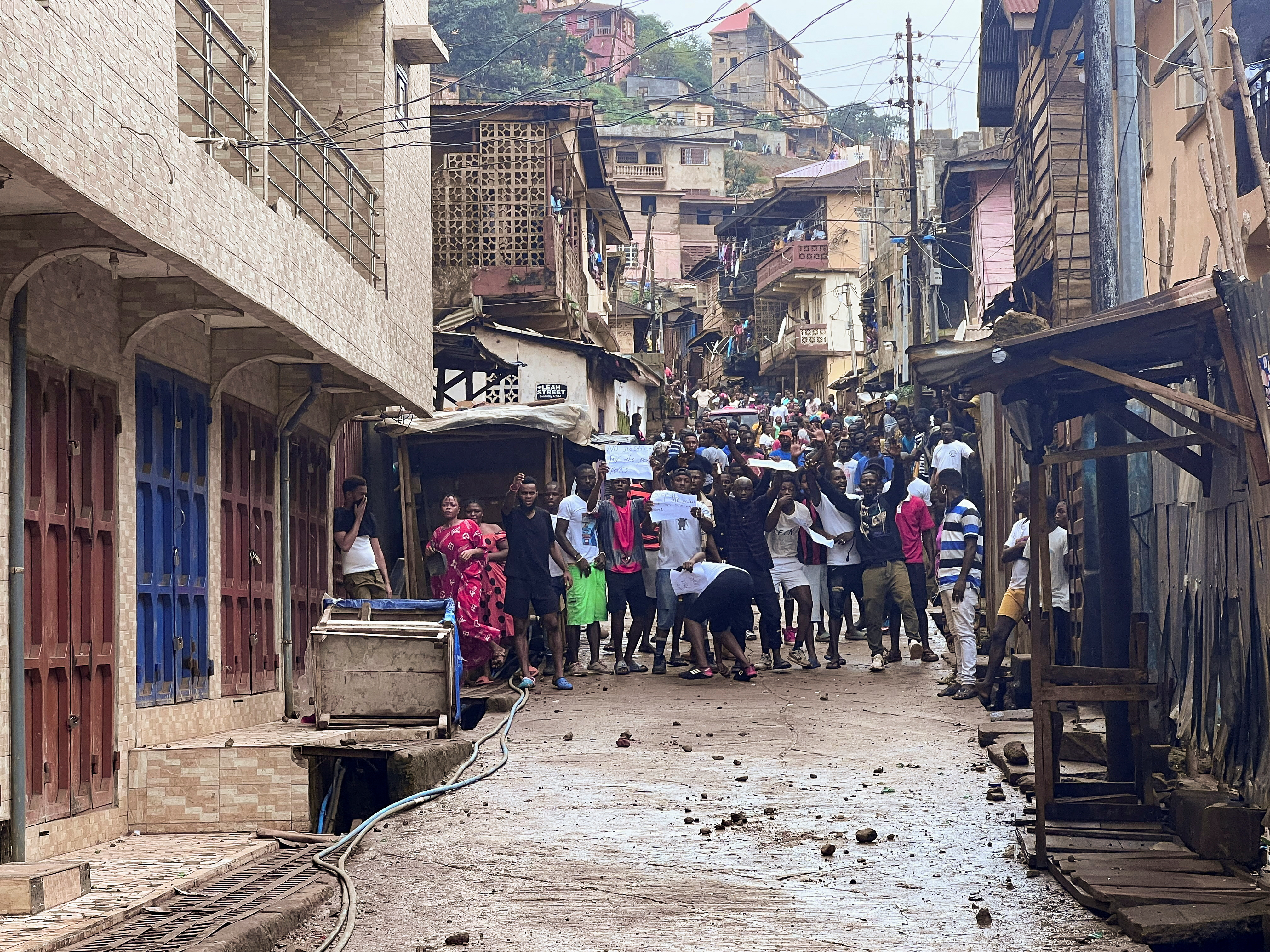 Protesters shout as they face riot police during anti-government protests in Freetown, Sierra Leone