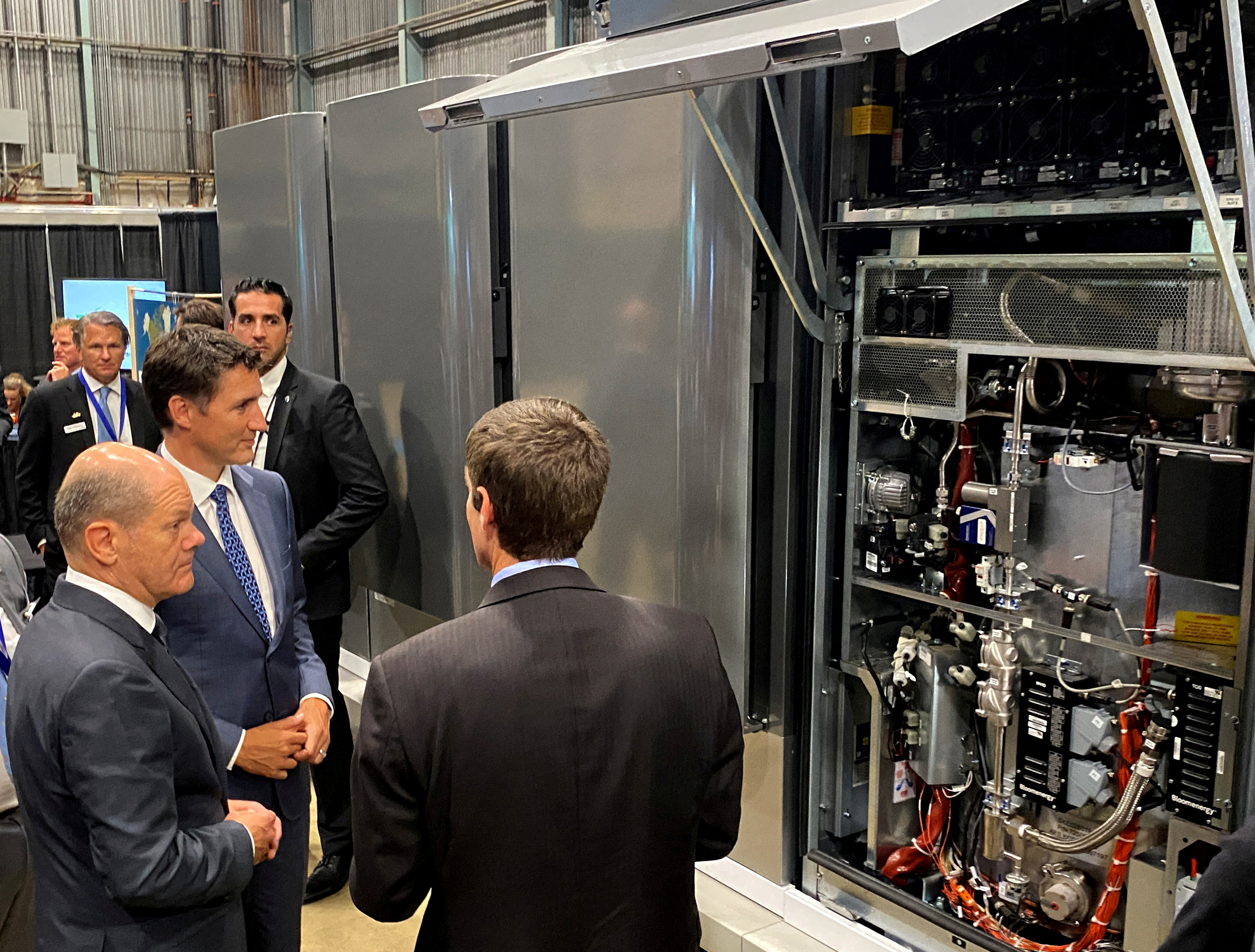 Justin Trudeau and Olaf Scholz tour a trade fair