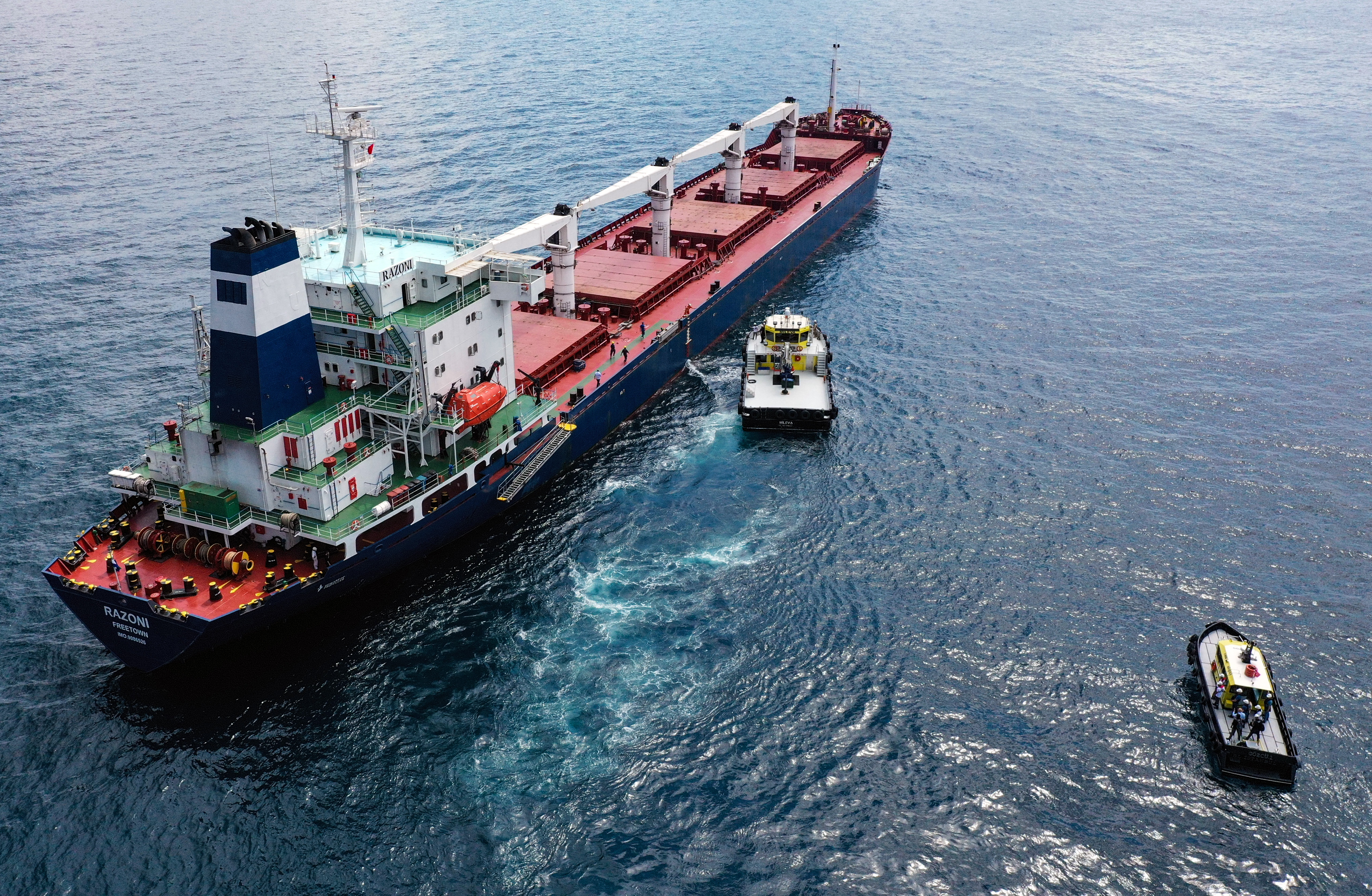 Inspectors from the Joint Coordination Centre are seen boarding the Razoni