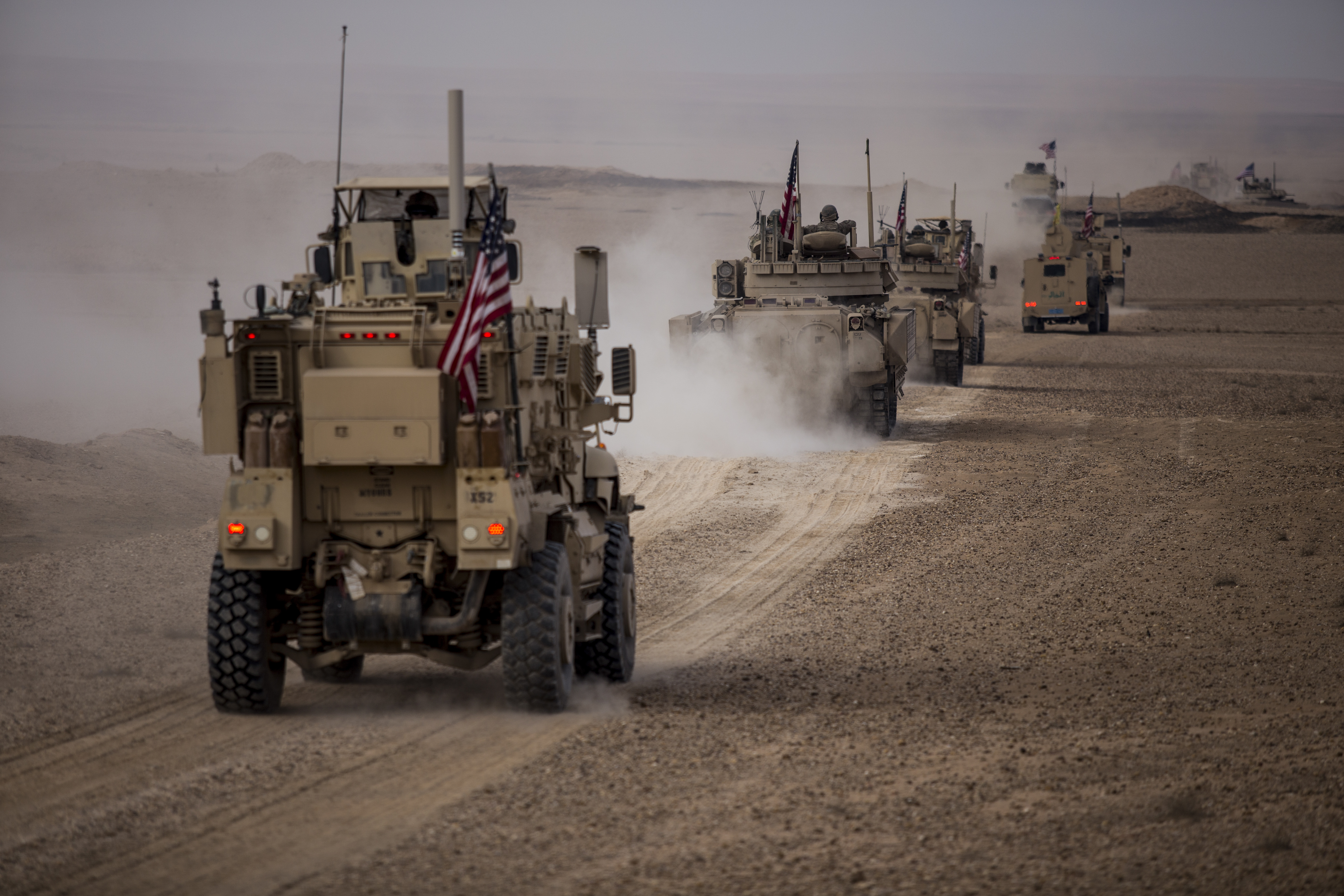 US military convoy travels across northeastern Syria during a joint exercise with the Syrian Democratic Forces on December 8, 2021 [File: Baderkhan Ahmad/AP Photo]