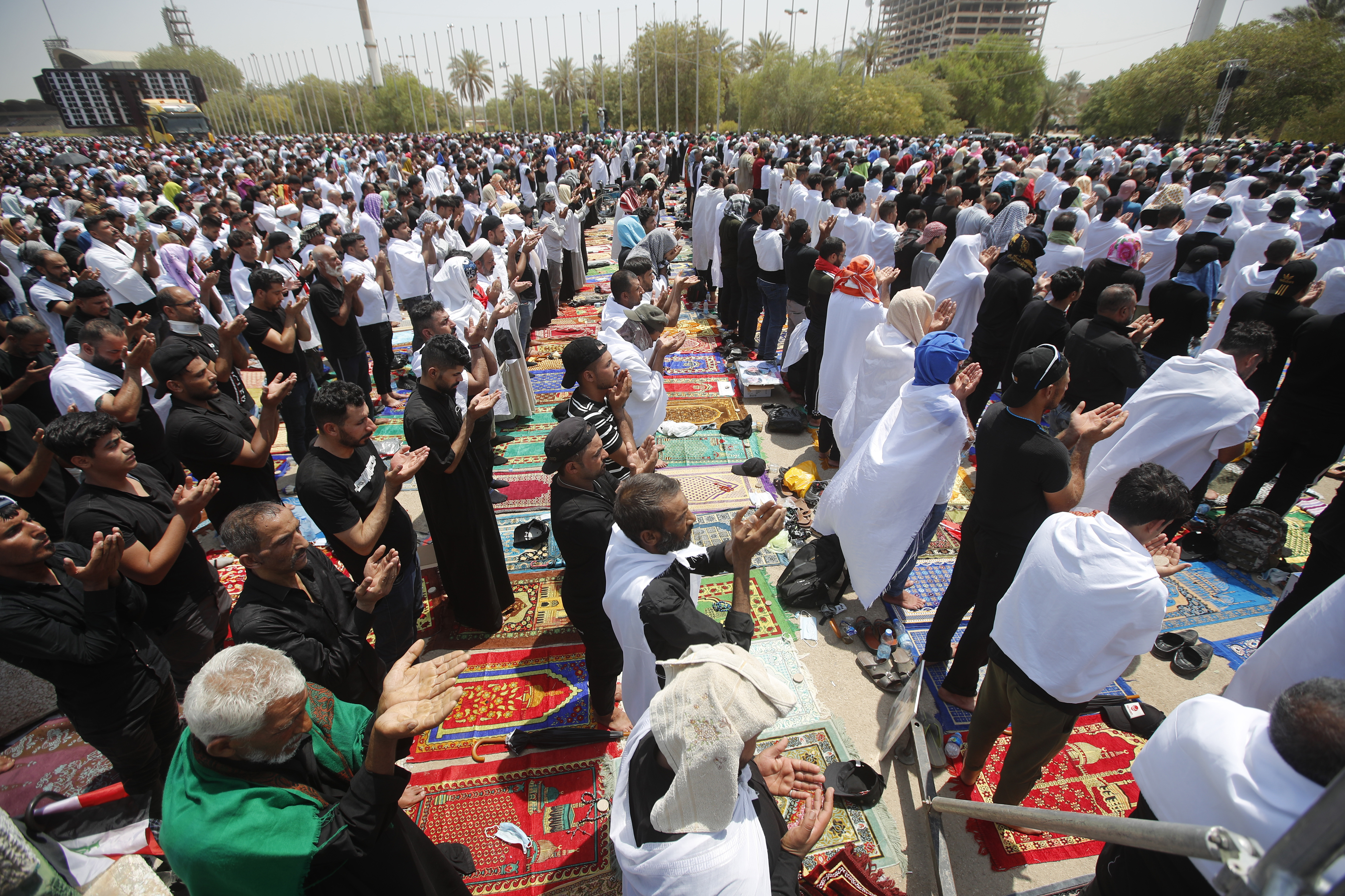 Followers of Muqtada al-Sadr attend open-air Friday prayers at Grand Festivities Square within the Green Zone, in Baghdad, Iraq on Friday, Aug. 5, 2022 [Anmar Khalil/AP]