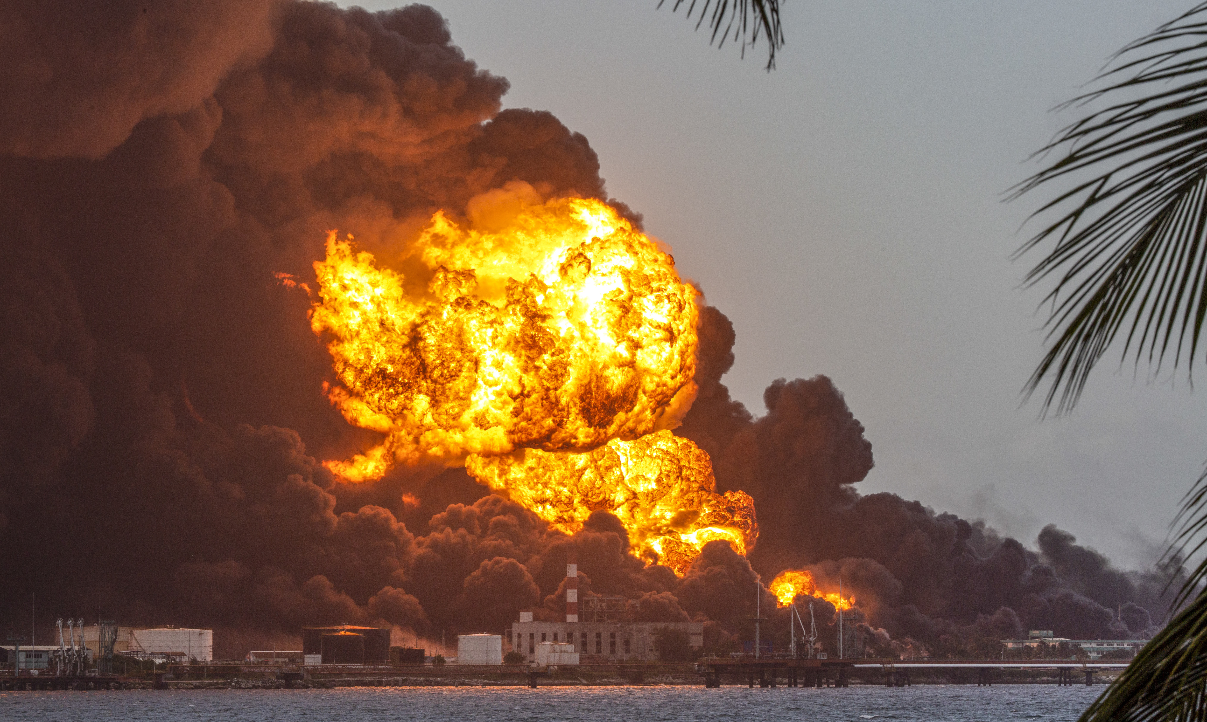 Flames and smoke rise from the Matanzas Supertanker Base as firefighters work to quell the blaze which began during a thunderstorm in Matanzas, Cuba