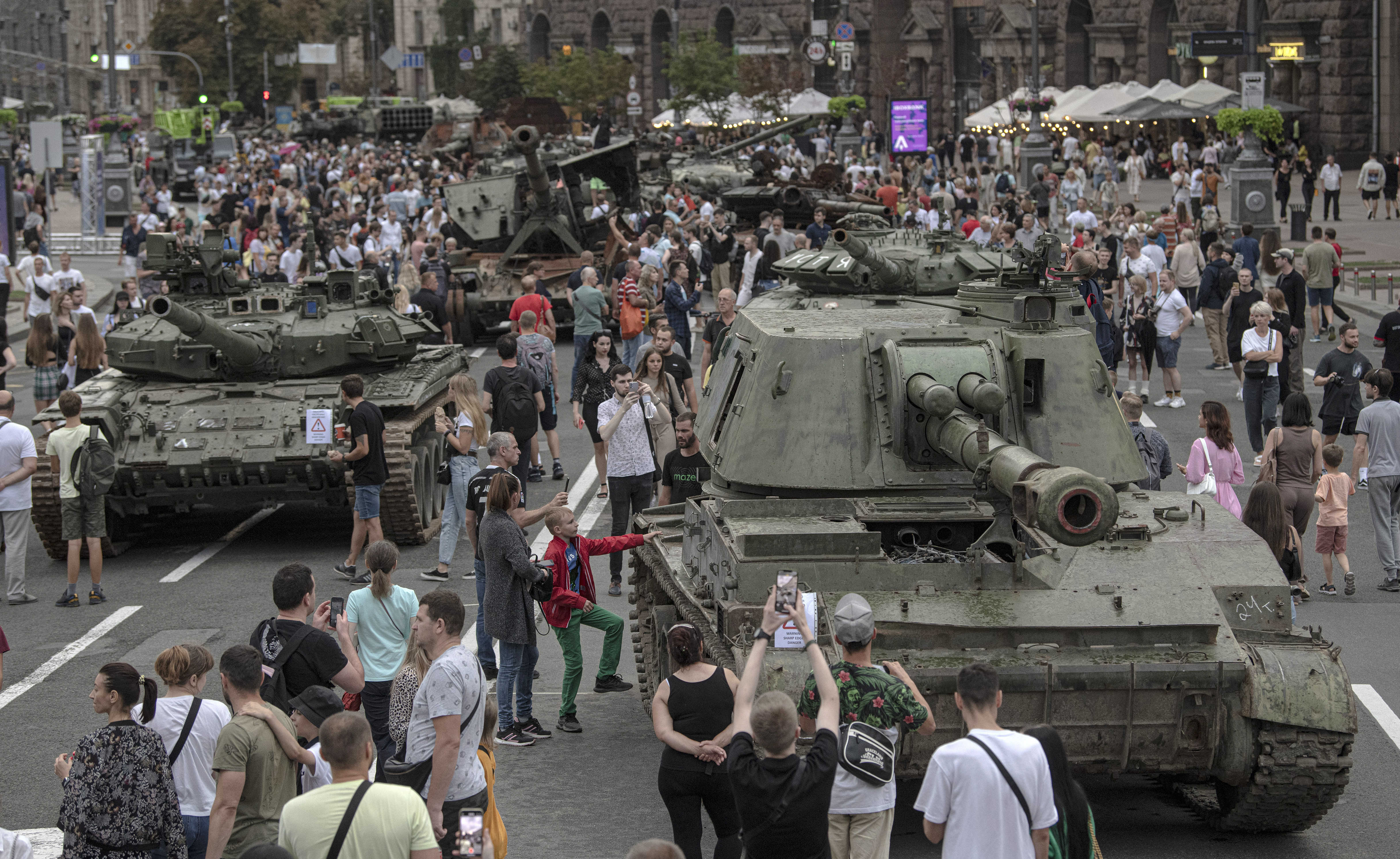 Ukrainians visit an avenue, where destroyed Russian military vehicles have been displayed in Kyiv, Ukraine