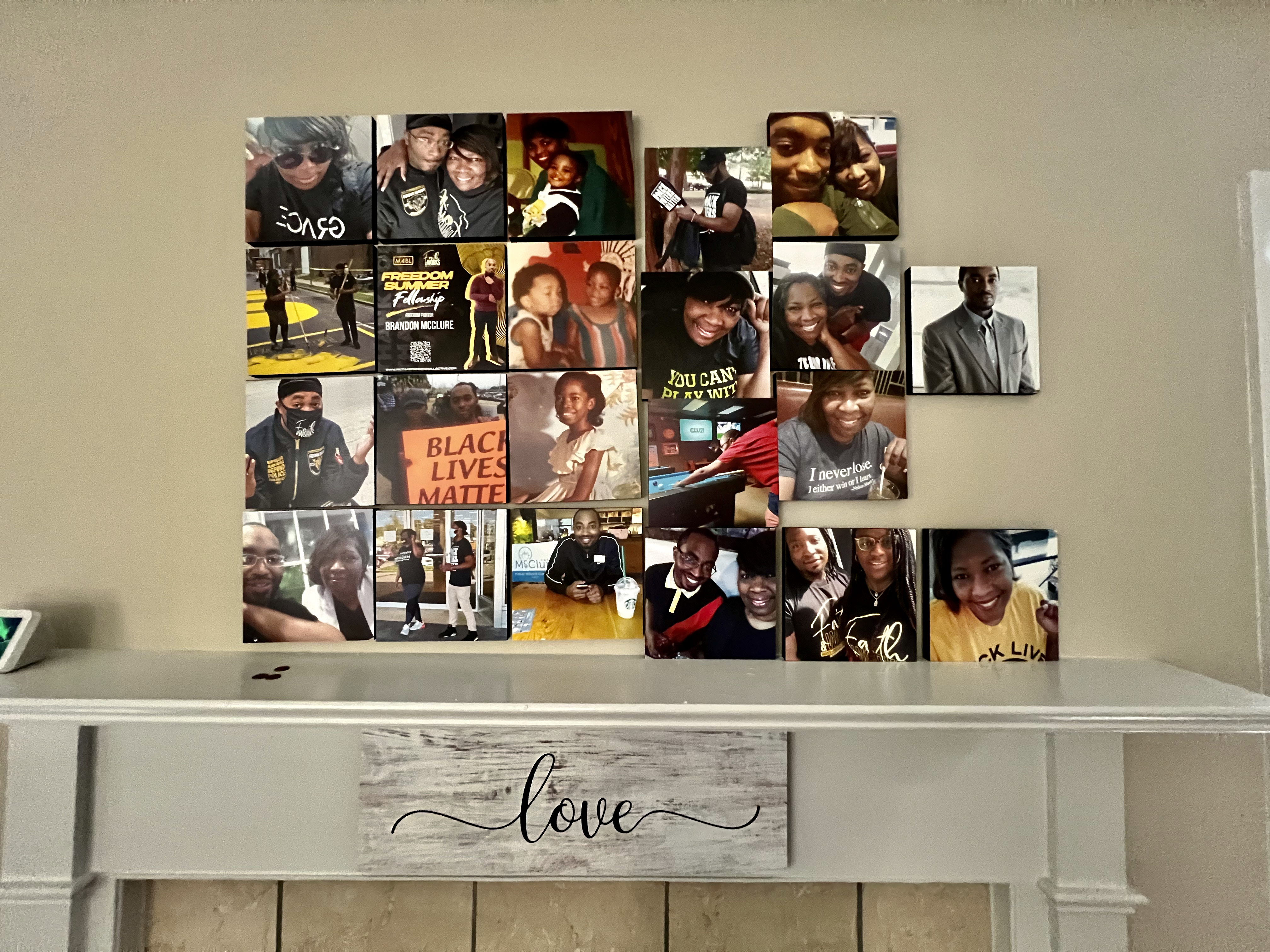 A collage of portraits above a fireplace