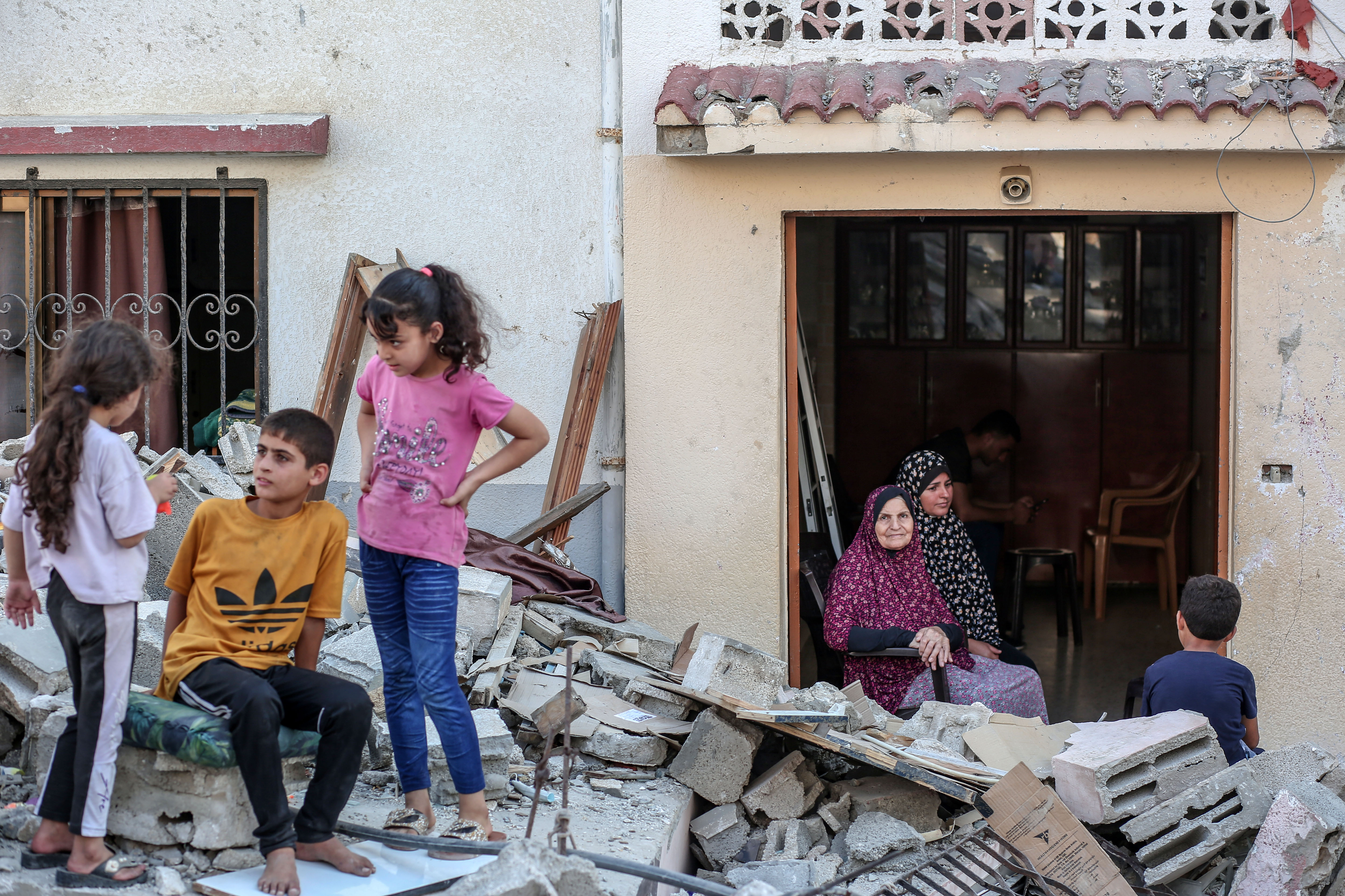 Nadia Shamallkh at her destroyed home in Gaza [Abdelhakim Abu Riash/Al Jazeera]