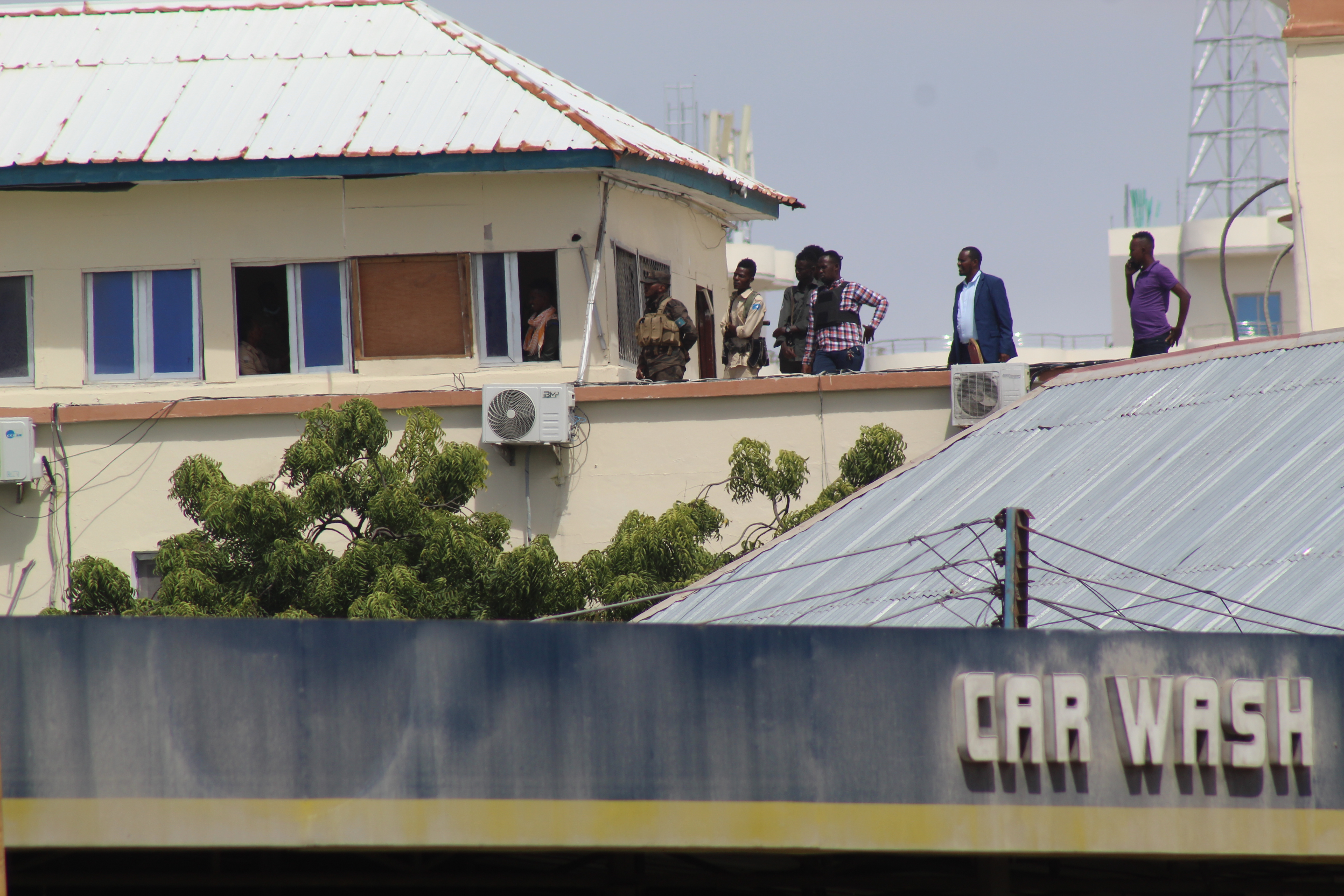 Somali security officials inspect the scene of an attack at the Hayat Hotel in Mogadishu, Somalia.